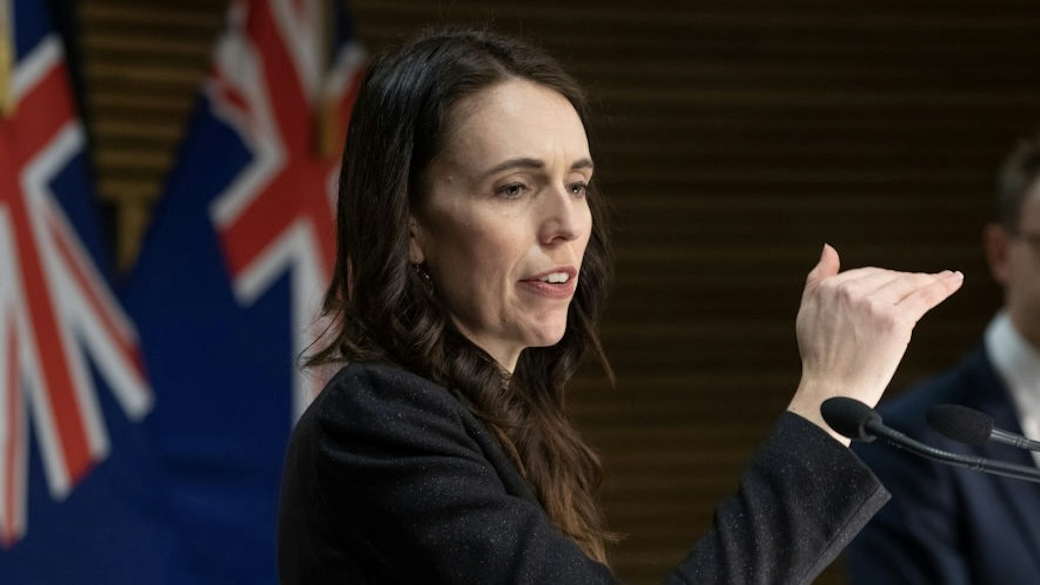 Prime Minister Jacinda Ardern Gives COVID-19 Update And Announces Home Isolation Pilot WELLINGTON, NEW ZEALAND - SEPTEMBER 27: Prime Minister Jacinda Ardern during her post-Cabinet press conference with Director General of Health Dr Ashley Bloomfield at Parliament on September 27, 2021 in Wellington, New Zealand. Prime Minister Jacinda Ardern has announced New Zealand will run a pilot program for small group of people travel overseas and self-isolate at home instead of hotel quarantine on their return to New Zealand (Photo by Mark Mitchell - Pool/Getty Images) Pool / Pool
