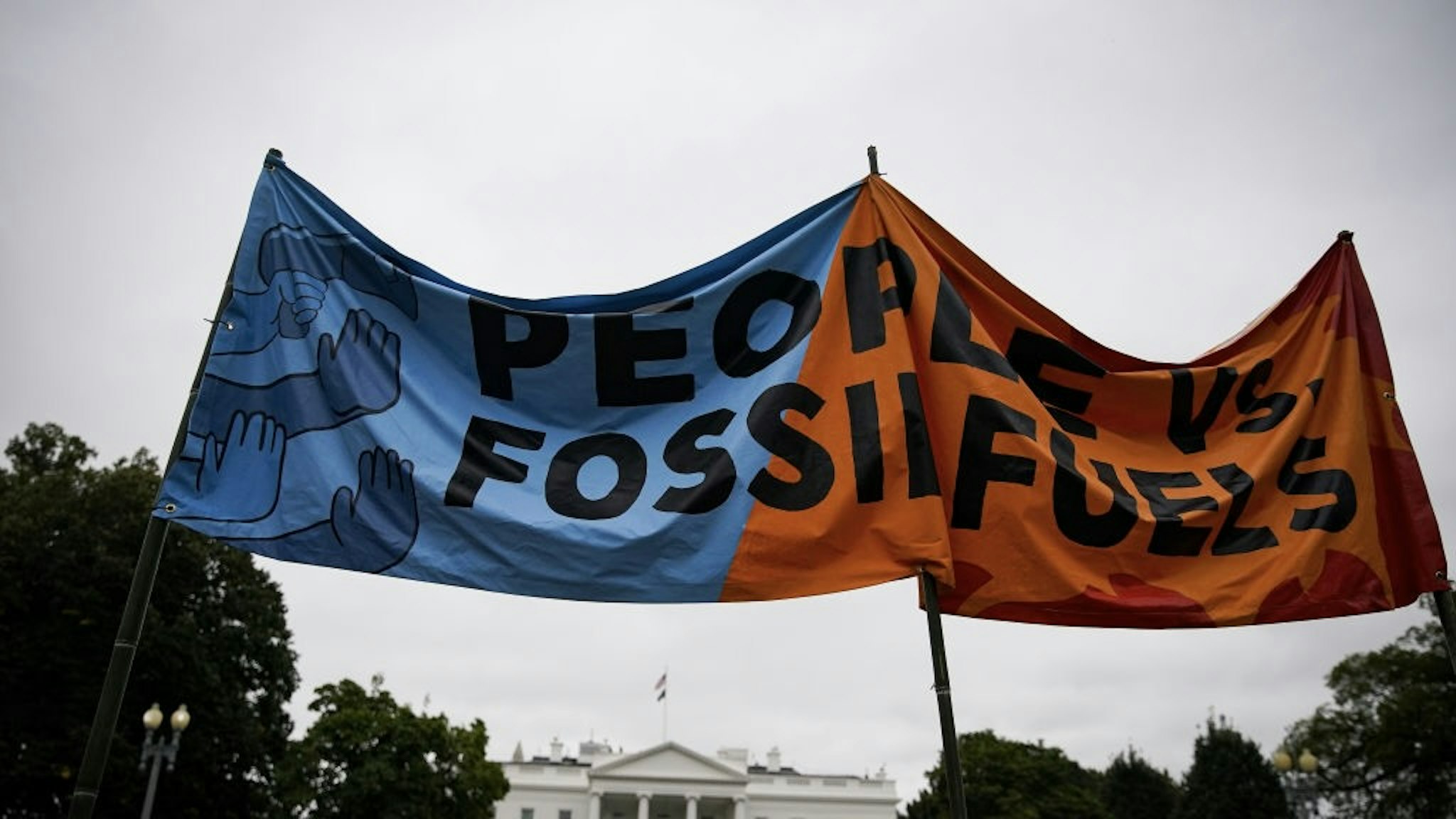 WHO Says Climate Change Is Single Biggest Health Threat Demonstrators hold a "People Vs. Fossil Fuels" banner during a climate change protest on Indigenous Peoples' Day outside the White House in Washington, D.C., U.S., on Monday, Oct. 11, 2021. Climate change is the single biggest health threat that humanity faces as extreme weather events kill thousands and weakens healthcare systems where they are needed the most, according to a new report by the World Health Organization. Photographer: Al Drago/Bloomberg via Getty Images Bloomberg / Contributor