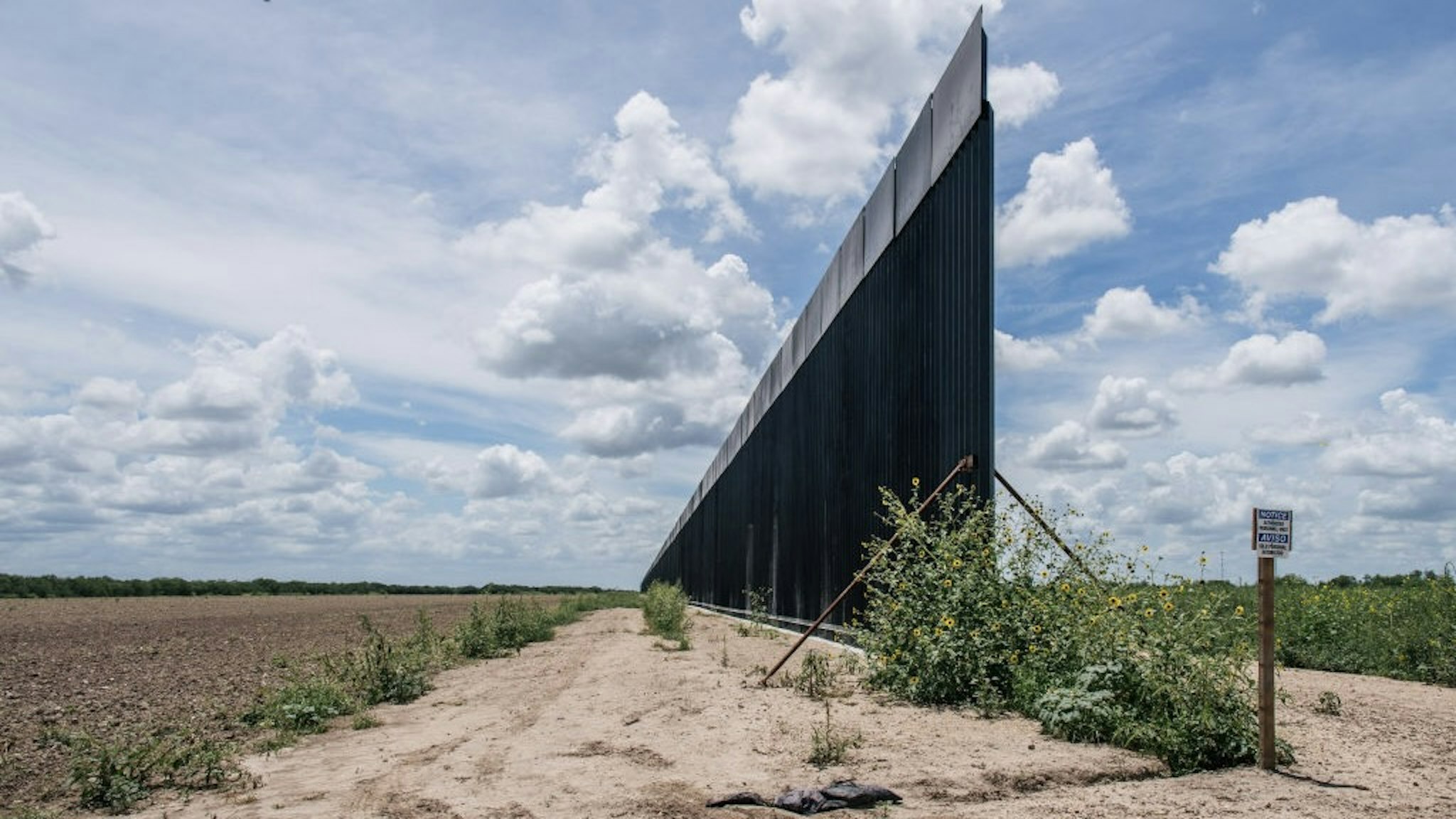 Migrants Continue To Cross Into Texas Despite Heat And Patrols LA JOYA, TEXAS - JULY 01: An unfinished section of border wall is seen on July 01, 2021 in La Joya, Texas. Recently, Texas Gov. Greg Abbott has pledged to build a state-funded border wall as a surge of mostly Central American immigrants crossing into the United States continues to challenge U.S. immigration agencies. So far in 2021, the border patrol has apprehended more than 900,000 immigrants crossing into the U.S. from Mexico. (Photo by Brandon Bell/Getty Images) Brandon Bell / Staff