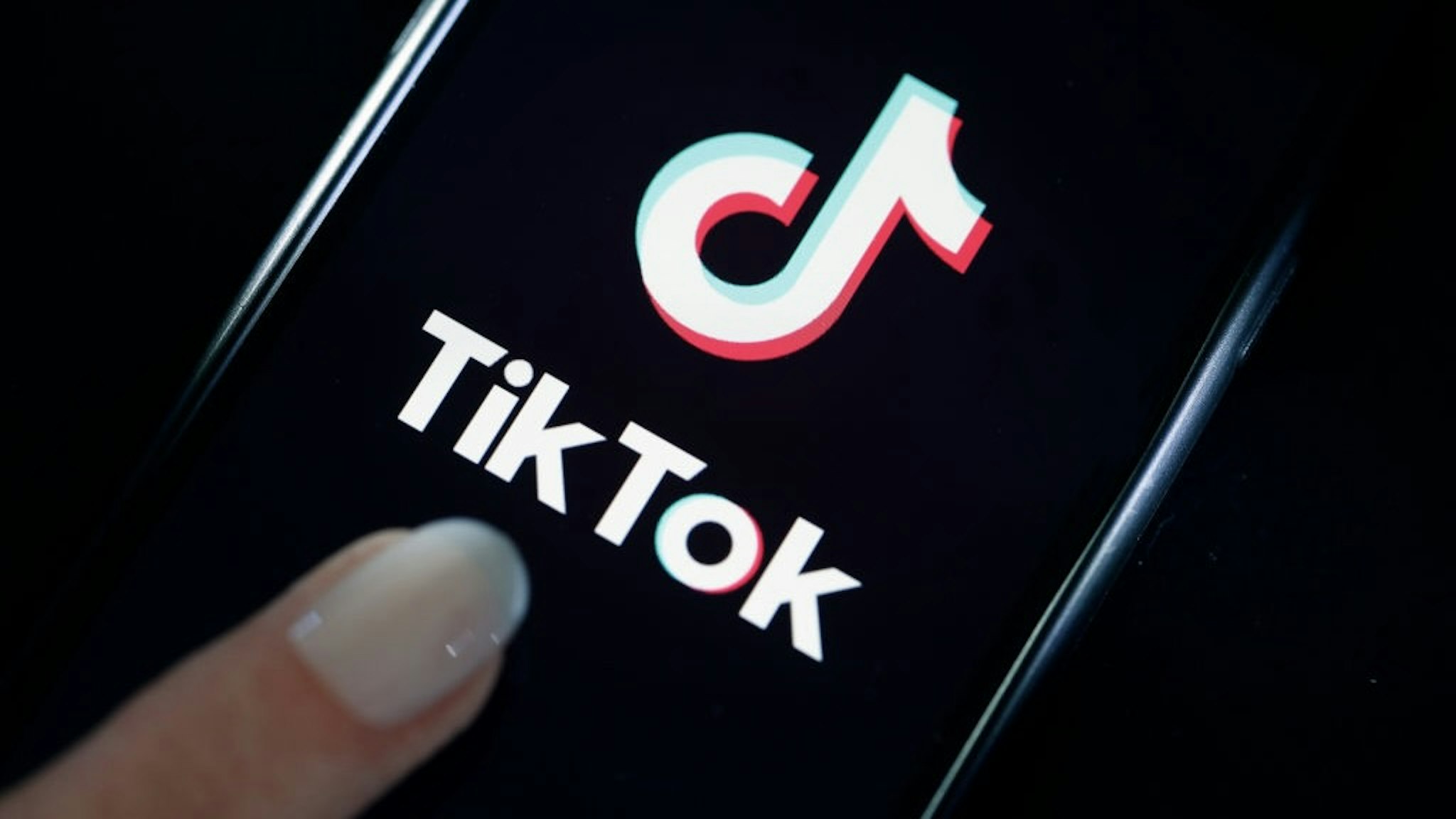 Tik Tok media App Illustration PARIS, FRANCE - MARCH 05: In this photo illustration, the social media application logo, Tik Tok is displayed on the screen of an iPhone on March 05, 2019 in Paris, France. The social network broke the rules for the protection of children's online privacy (COPPA) and was fined $ 5.7 million. The fact TikTok criticized is quite serious in the United States, the platform, which currently has more than 500 million users worldwide, collected data that should not have asked minors. TikTok, also known as Douyin in China, is a media app for creating and sharing short videos. Owned by ByteDance, Tik Tok is a leading video platform in Asia, United States, and other parts of the world. In 2018, the application gained popularity and became the most downloaded app in the U.S. in October 2018. (Photo by Chesnot/Getty Images) Chesnot / Contributor