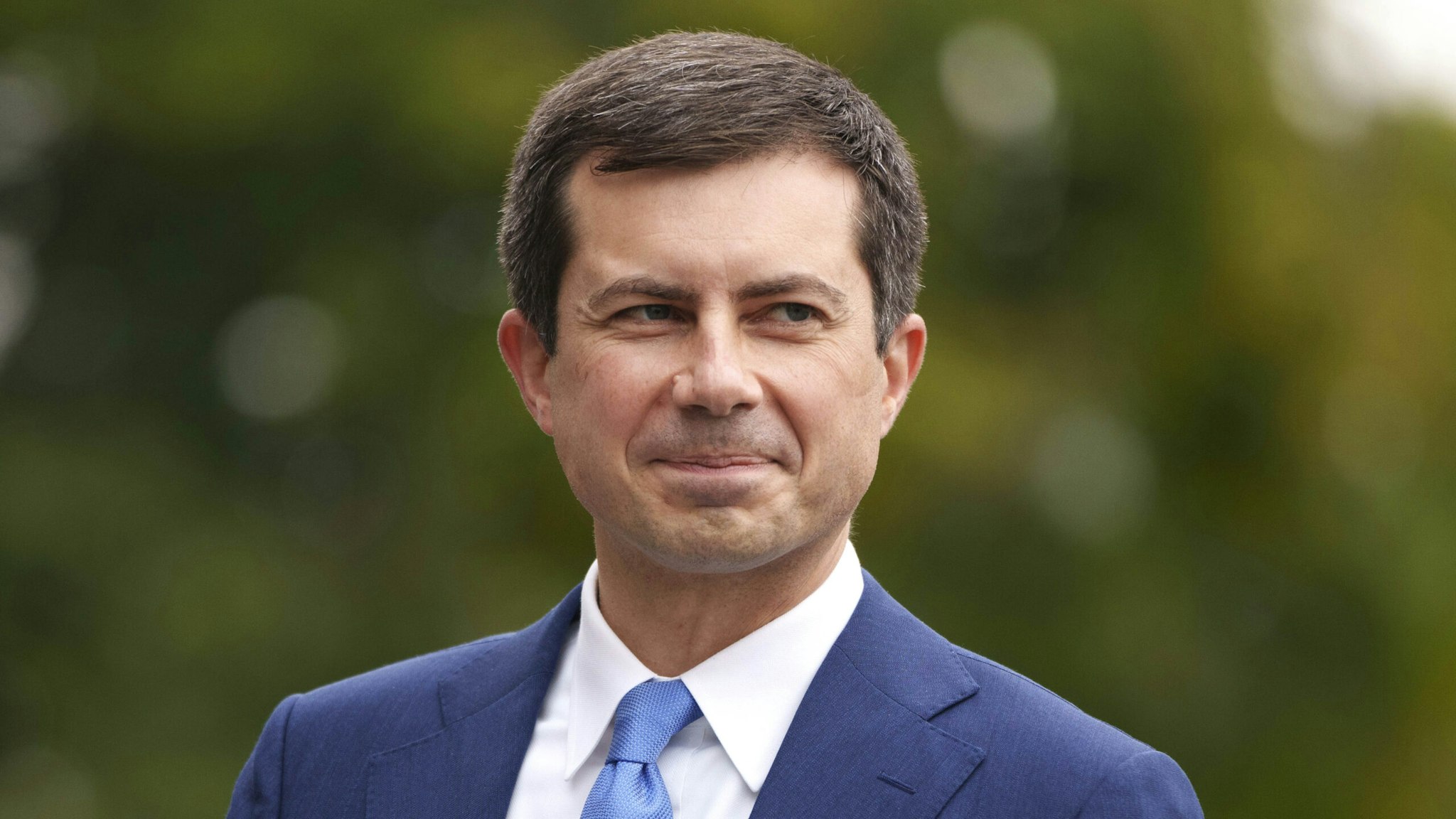 WASHINGTON, DC - OCTOBER 13: U.S. Transportation Secretary Pete Buttigieg arrives for a television interview with CNBC outside the White House October 13, 2021 in Washington, DC. With the holiday season approaching, President Biden is expected to announce that the Port of Los Angeles will begin to operate 24 hours a day in efforts to relieve the backlog in the supply chain that delivers goods to the United States. Americans have seen delays in a host of consumer goods, including electronics, cars, lumber, toys and more.