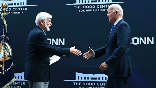 US-POLITICS-BIDEN Former US Senator Chris Dodd (D-CT) greets US President Joe Biden (R) at the dedication of the Dodd Center for Human Rights at the University of Connecticut on October 15, 2021 in Storrs, Connecticut.