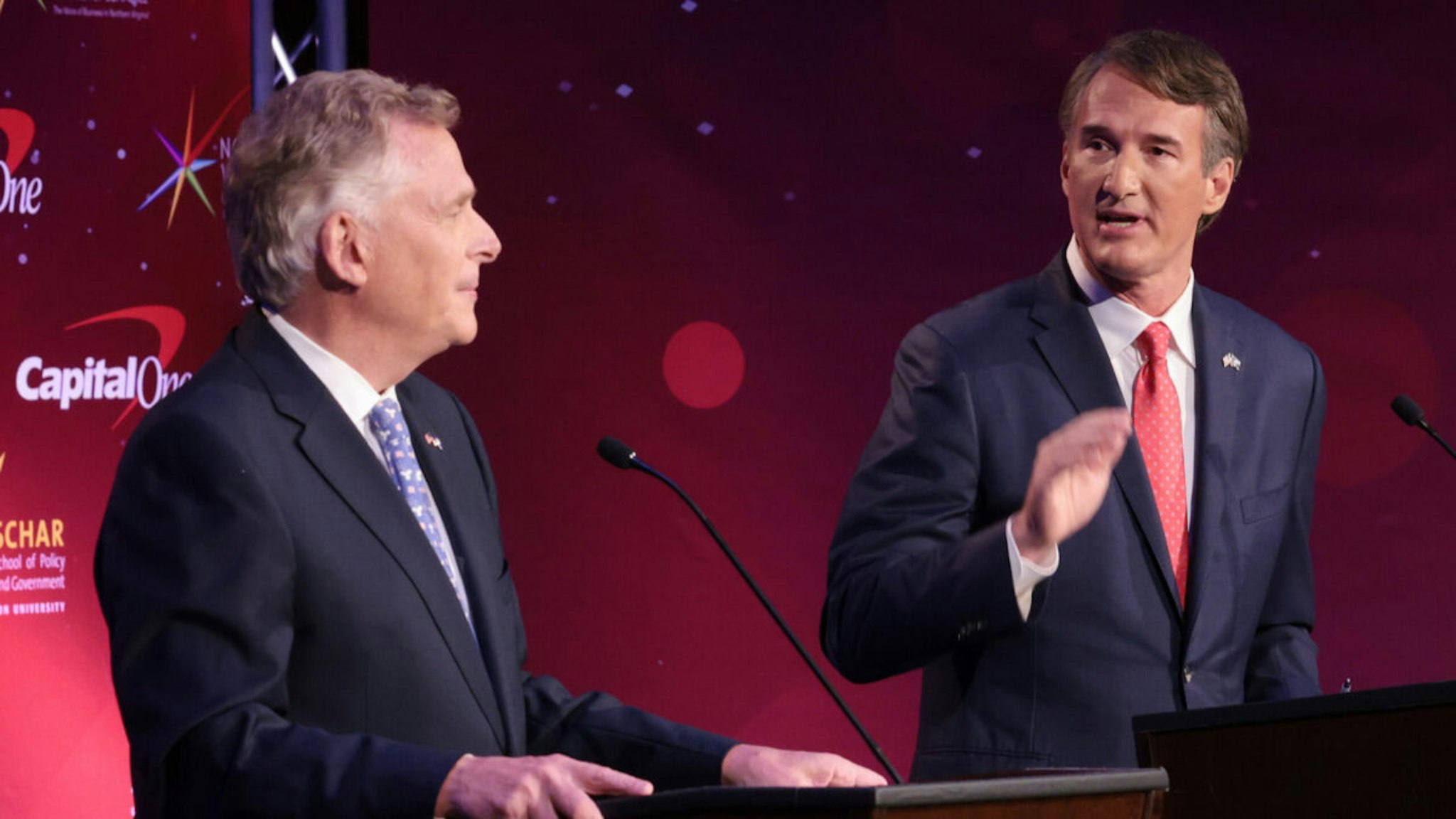 Former Virginia Gov. Terry McAuliffe (L) and Republican gubernatorial candidate Glenn Youngkin (R) participate in the final debate between the two candidates hosted by the Northern Virginia Chamber of Commerce September 28, 2021 in Alexandria, Virginia.