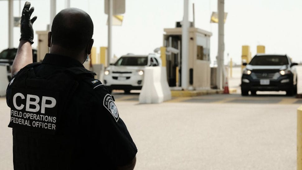 C7EC89B8-7104-4D1F-A118-4DE305B7C003_1_201_a Canada Allows Vaccinated U.S. Citizens Back Across Its Borders DETROIT, MI - AUGUST 09: U.S. Customs and Border Protection agents direct vehicles re-entering the U.S. from Canada, which has opened its borders to U.S. citizens who can provide proof of vaccination and a negative Covid-19 test, for random searches and inspections at the Ambassador Bridge Port of Entry August 9, 2021 in Detroit, Michigan. The border had been closed to non-essential travel since March 2020. (Photo by Matthew Hatcher/Getty Images) Matthew Hatcher / Stringer