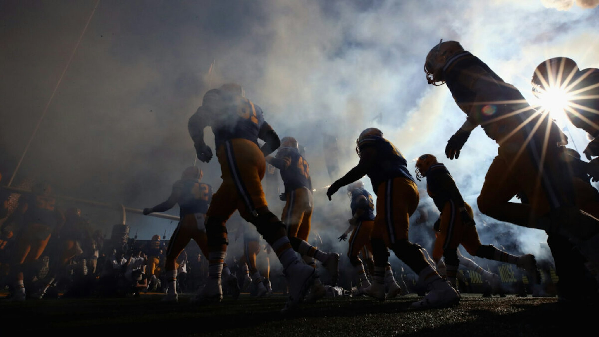 The California Golden Bears run out on to the field for their game against the UCLA Bruins at California Memorial Stadium on October 13, 2018 in Berkeley, California.