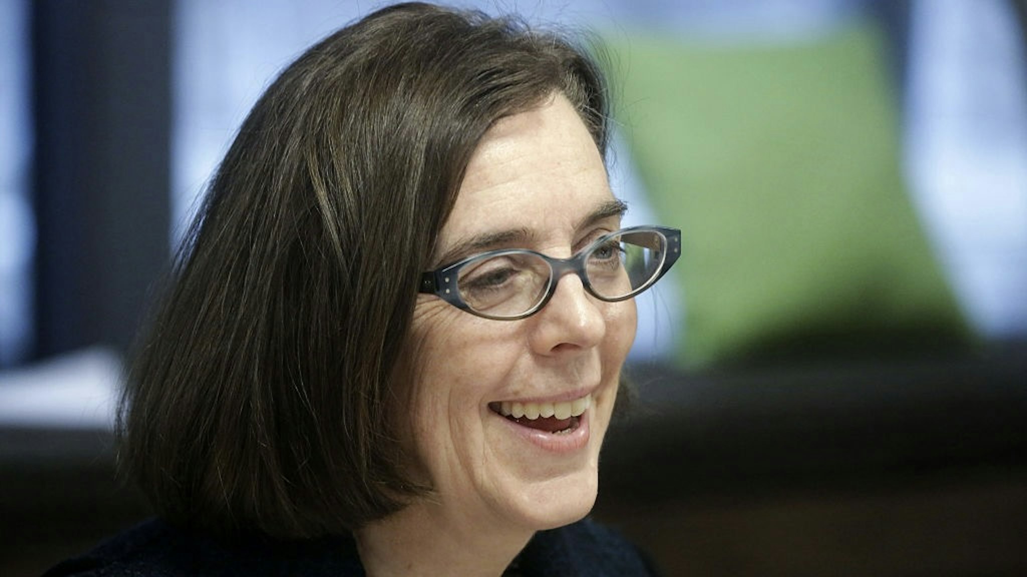 Oregon Governor Kate Brown Interview Kate Brown, governor of Oregon, smiles during an interview in Portland, Oregon, U.S. on Wednesday, Jan. 20, 2016. Brown, a Democrat, joined the state House of Representatives in 1991, was later elected to the Senate and served as secretary of state since 2009, before taking over as governor in February. Photographer: Meg Roussos/Bloomberg via Getty Images Bloomberg / Contributor