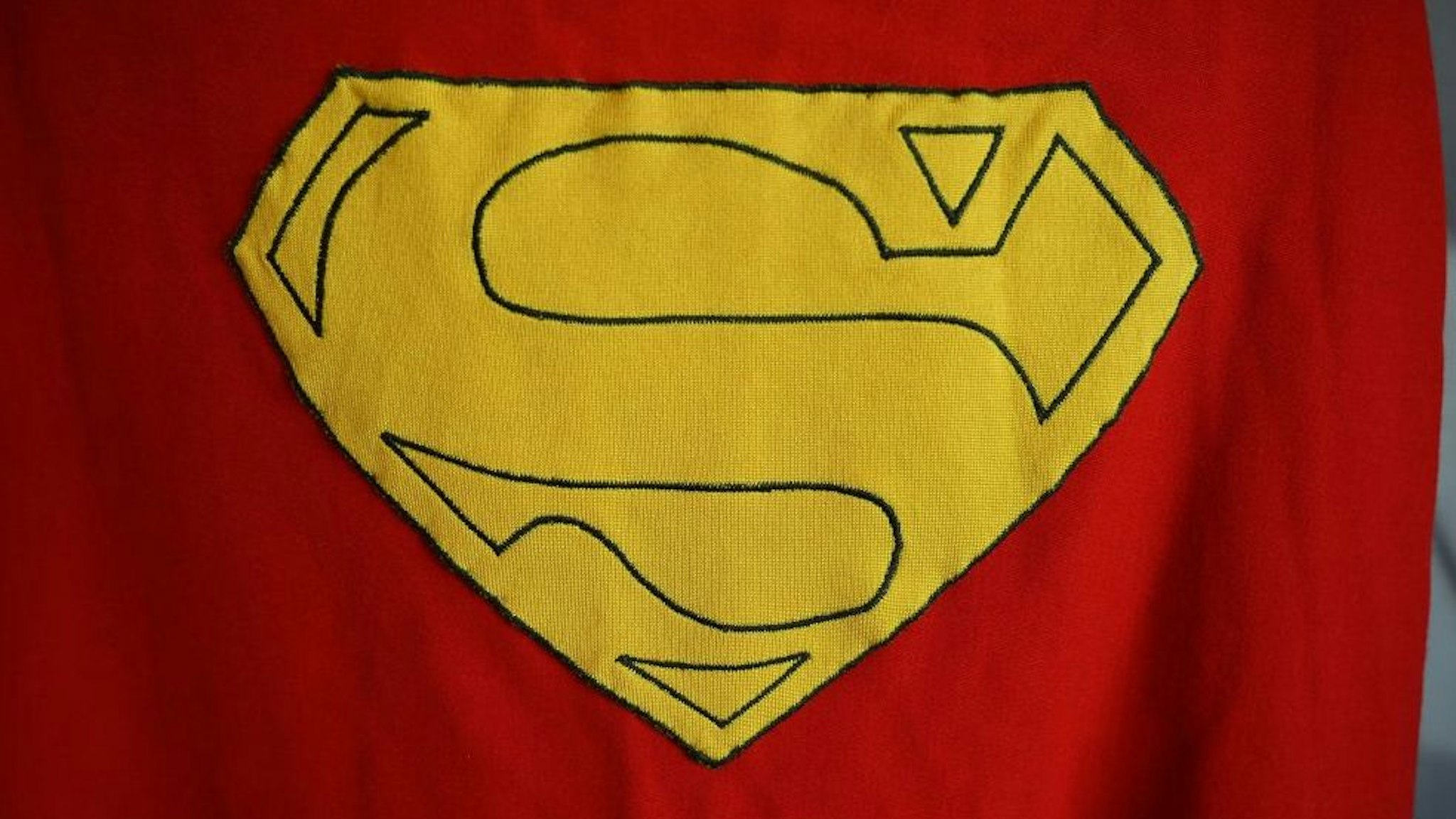 An original Superman cape worn by actor Christopher Reeve in the 1978 "Superman" film (estimate $100,000 -2000,000 $ USD) is displayed at Julien's Auctions house on December 13, 2019 ahead of Julien's Icons & Idols: Hollywood Auction which takes place on December 16, 2019.