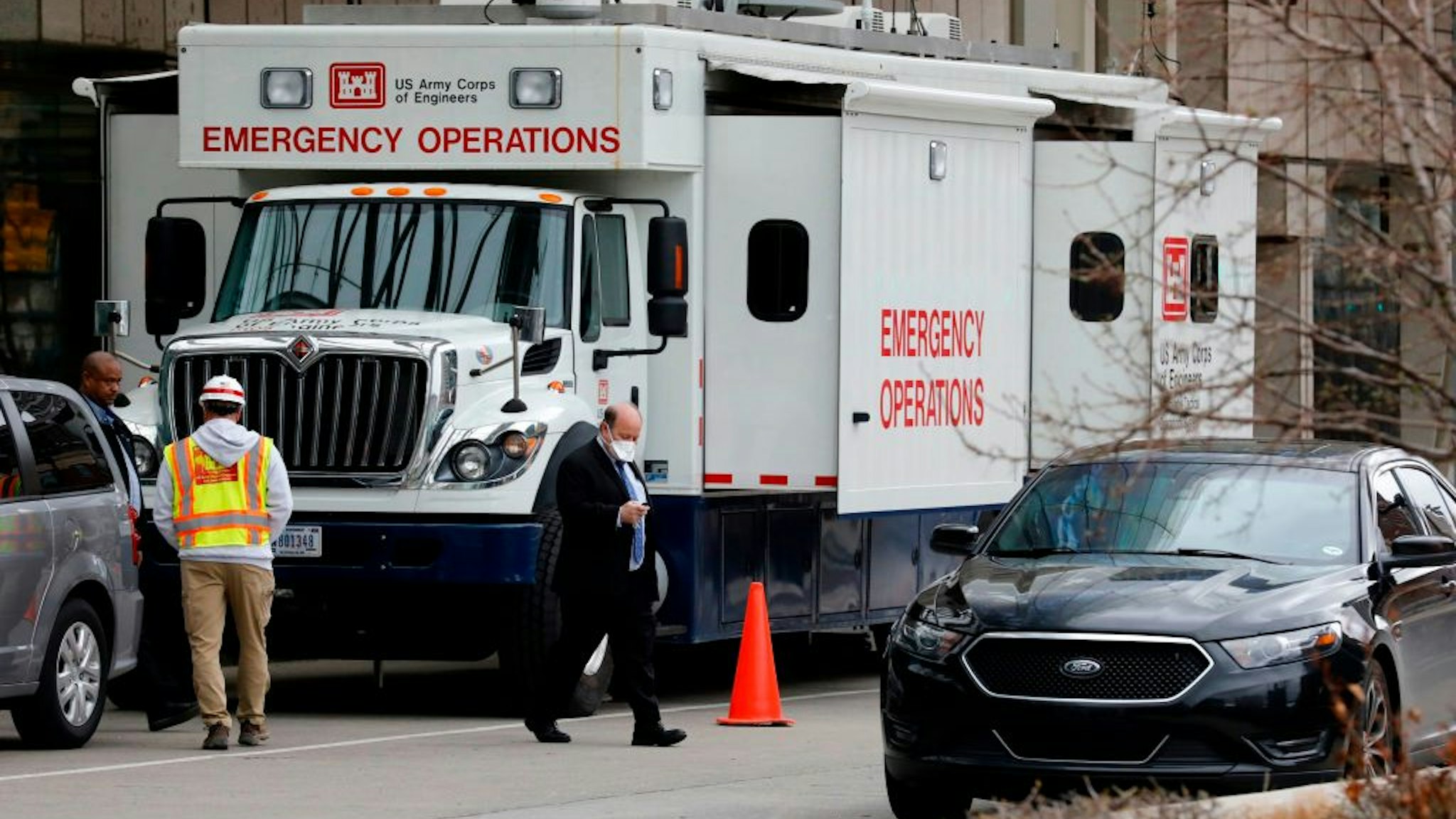 Detroit Mayor Mike Duggan leaves a briefing outside of TCF Center as it is being converted by the US Army Corps of Engineers in to a field hospital in Detroit, Michigan on April 1, 2020.