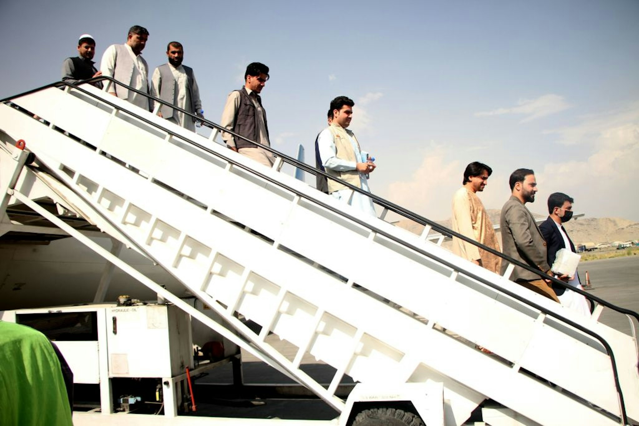 Passengers disembark from a plane at Kabul International Airport in Kabul, capital of Afghanistan, Sept. 20, 2021.