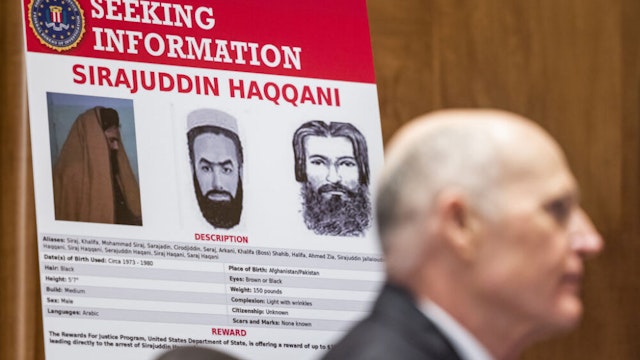 An FBI Most Wanted poster of Sirajuddin Haqqani, leader of the Haqqani Network, during a Senate Homeland Security Committee hearing in Washington, D.C., U.S., on Tuesday, Sept. 21, 2021. The Department of Homeland Security is investigating a heated confrontation between border patrol agents on horseback and Haitian migrants seeking asylum in the U.S.