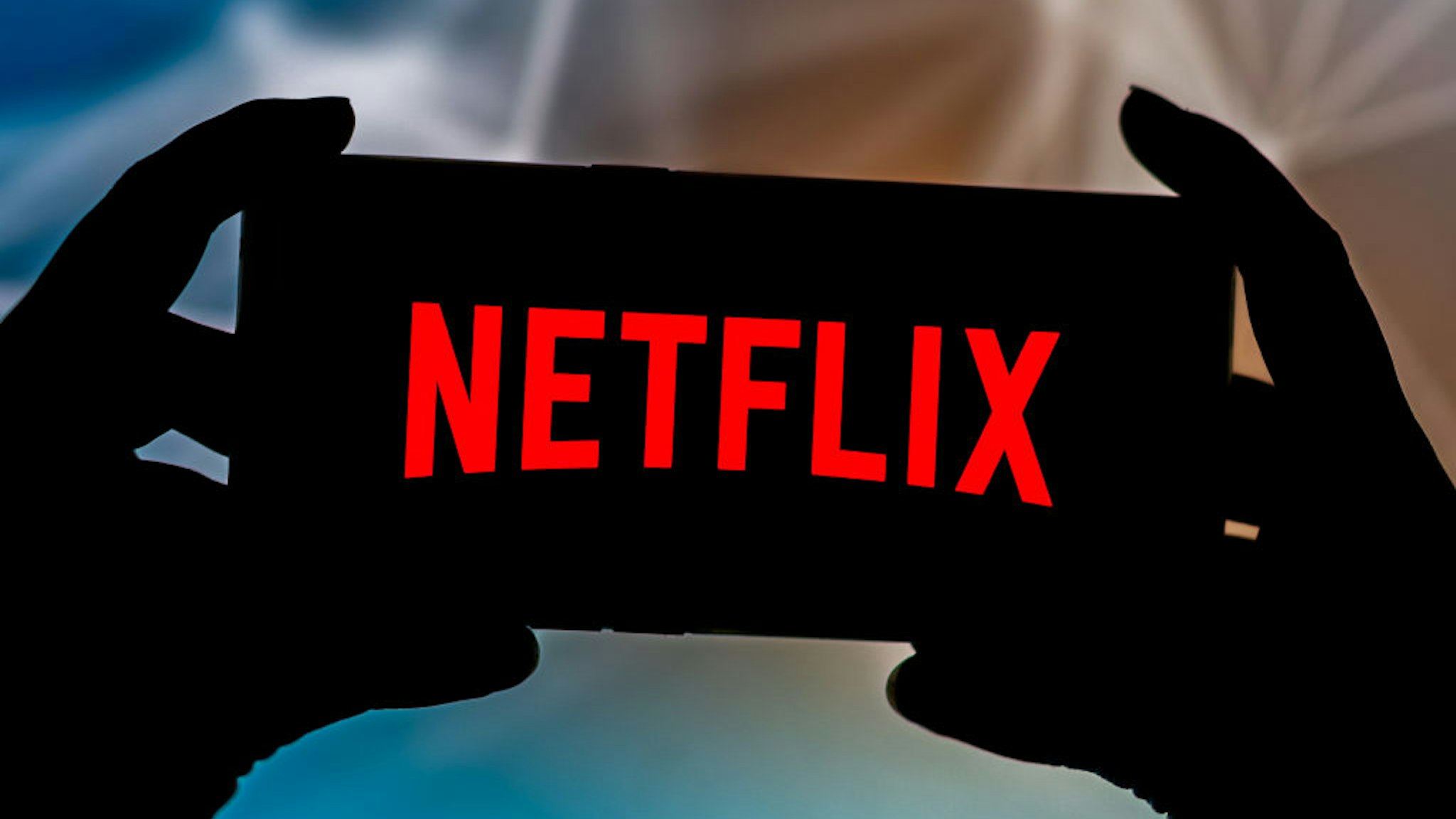 In this photo illustration a Netflix logo seen displayed on a smartphone.