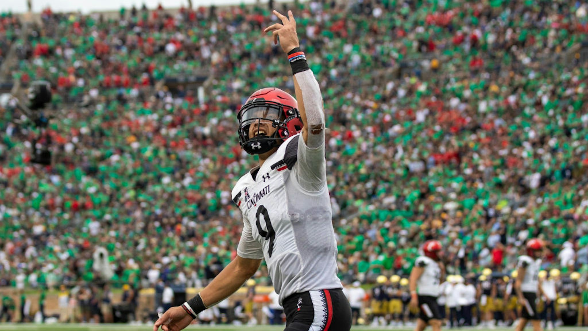 SOUTH BEND, IN - OCTOBER 02: Cincinnati Bearcats quarterback Desmond Ritter (9) celebrates after scoring a touchdown in the 2nd half against the Notre Dame Fighting Irish during a game between the Notre Dame Fighting Irish and the Cincinnati Bearcats on October, 2021 at Notre Dame Stadium in South Bend, IN. (Photo by Brandon Sloter/Icon Sportswire via Getty Images)