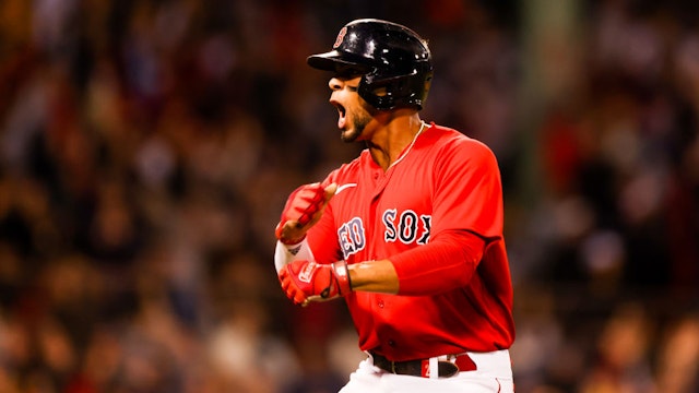 BOSTON, MA - OCTOBER 05: Xander Bogaerts #2 of the Boston Red Sox reacts after hitting a two-run home run in the first inning of the game between the New York Yankees and the Boston Red Sox at Fenway Park on Tuesday, October 5, 2021 in Boston, Massachusetts. (Photo by Rob Tringali/MLB Photos via Getty Images)