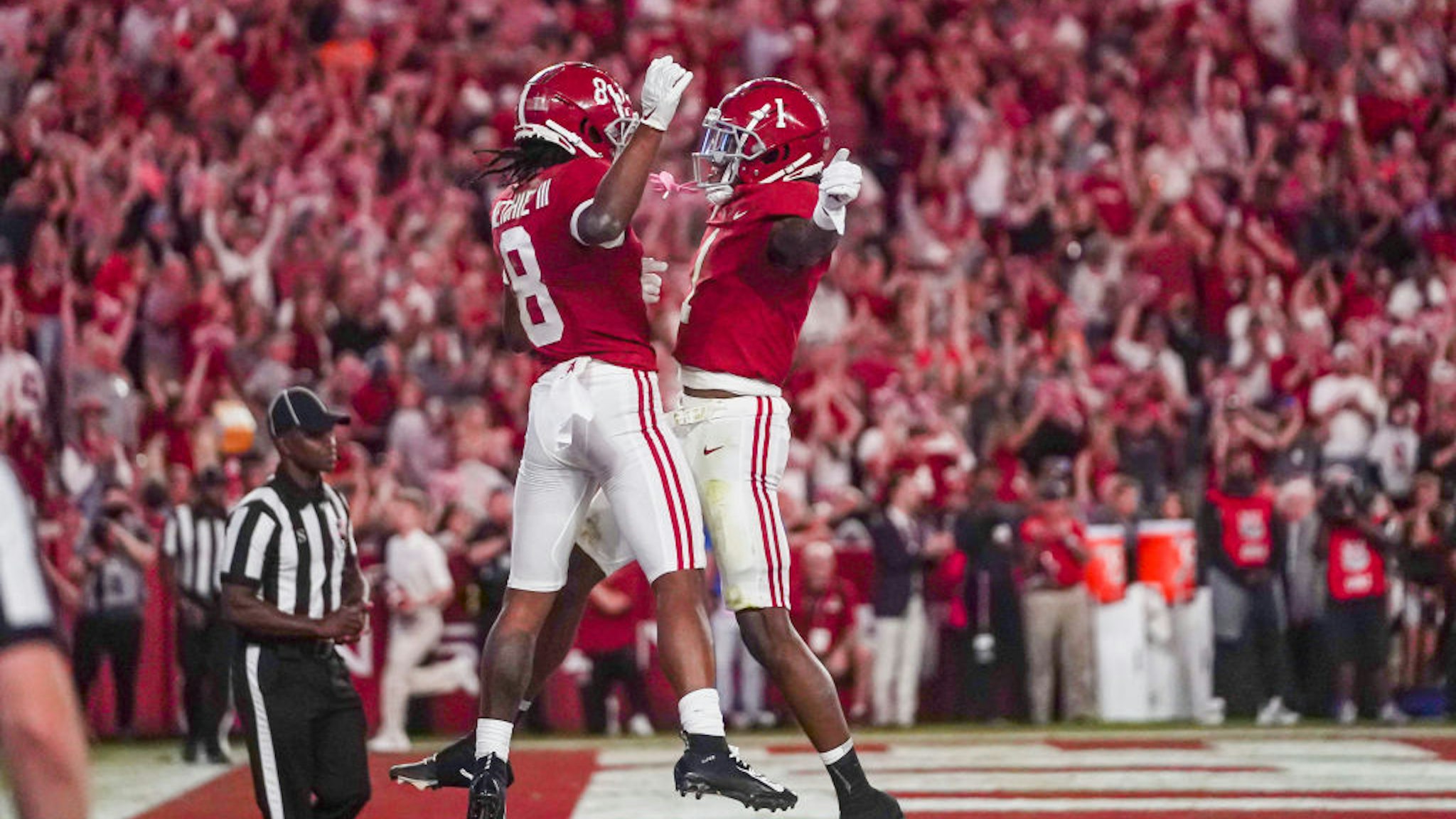 TUSCALOOSA, ALABAMA - OCTOBER 23: John Metchie III #8 of the Alabama Crimson Tide and Jameson Williams #1 of the Alabama Crimson Tide celebrate after Metchie scores in the second half at Bryant Denny Stadium on October 23, 2021 in Tuscaloosa, Alabama (Photo by Marvin Gentry/Getty Images )