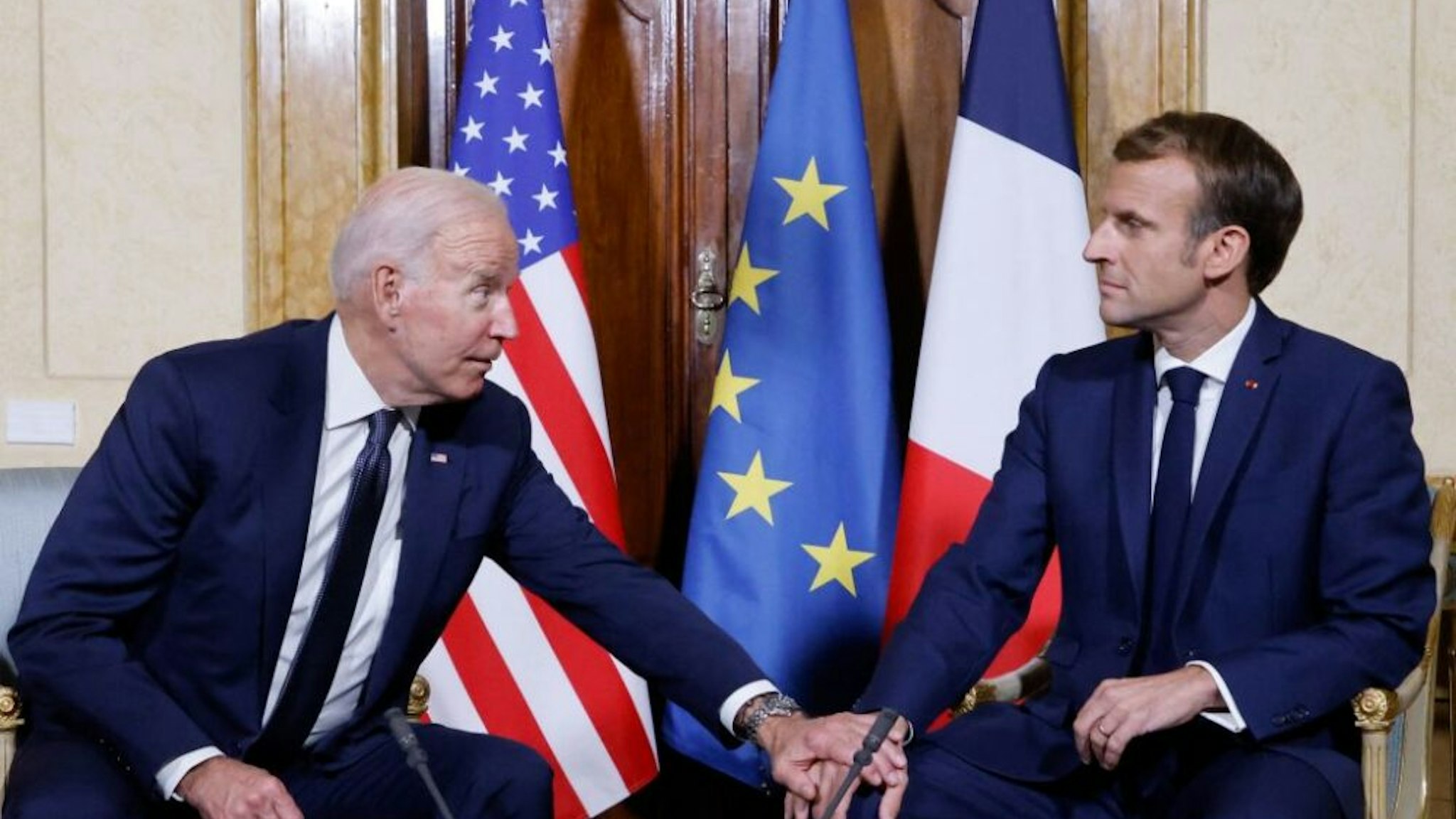 French President Emmanuel Macron (R) and US President Joe Biden (L) meet at the French Embassy to the Vatican in Rome on October 29, 2021.