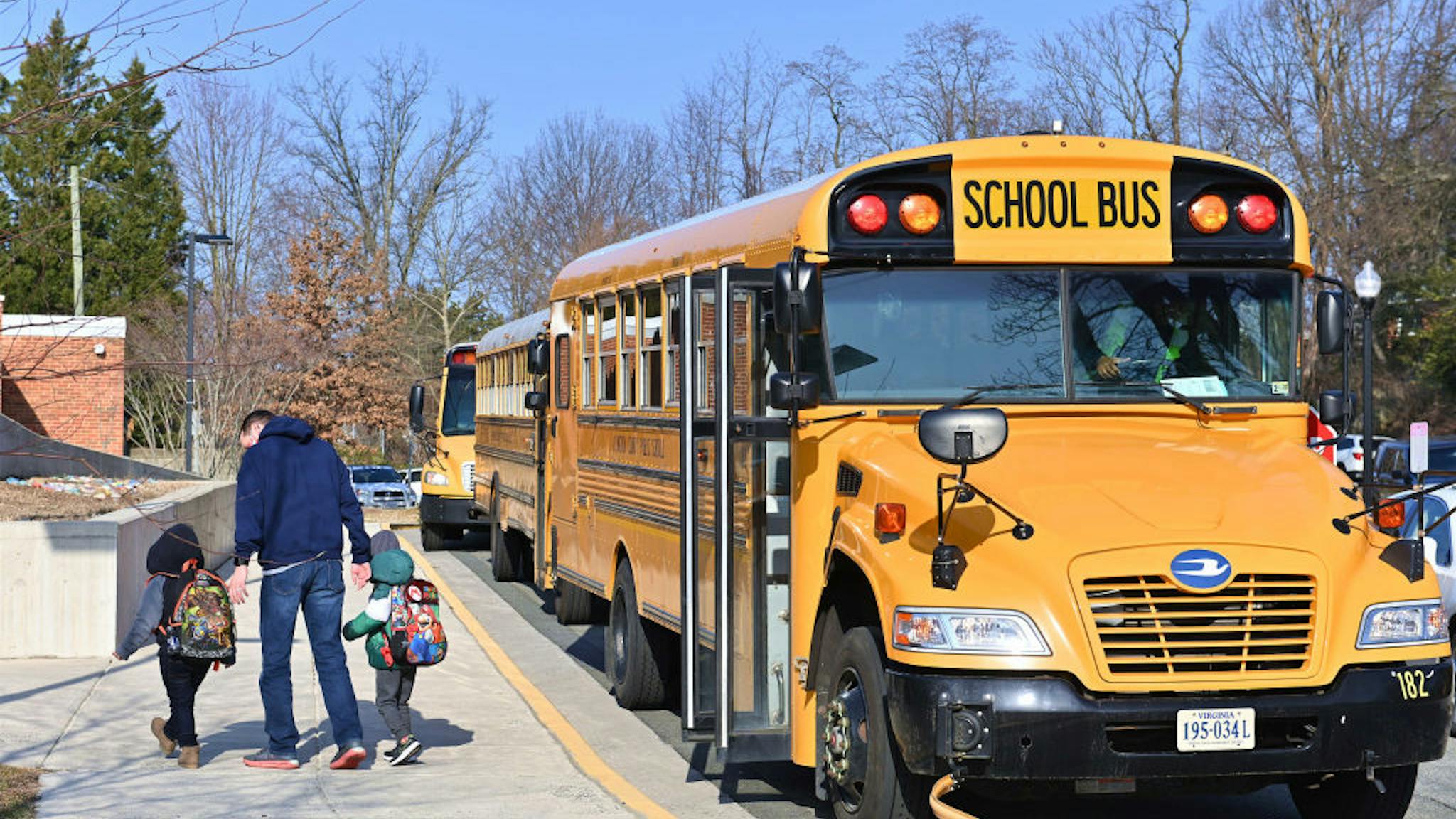 School Reopens In Virginia A school bus arrives at Ashlawn elementary school on March 4, 2021 in Arlington, VA.