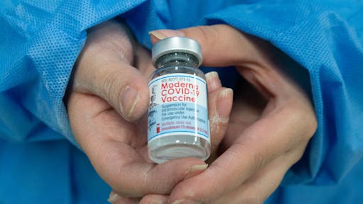 moderna A nurse shows the vial of the Moderna novel Coronavirus vaccine as public transport drivers and people from ages 25 to 30 start their vaccination phase with the Moderna novel COVID-19 vaccine against the Coronavirus disease in Bogota, Colombia on August 2, 2021. (Photo by:Martin Galindo/Long Visual Press/Universal Images Group via Getty Images)