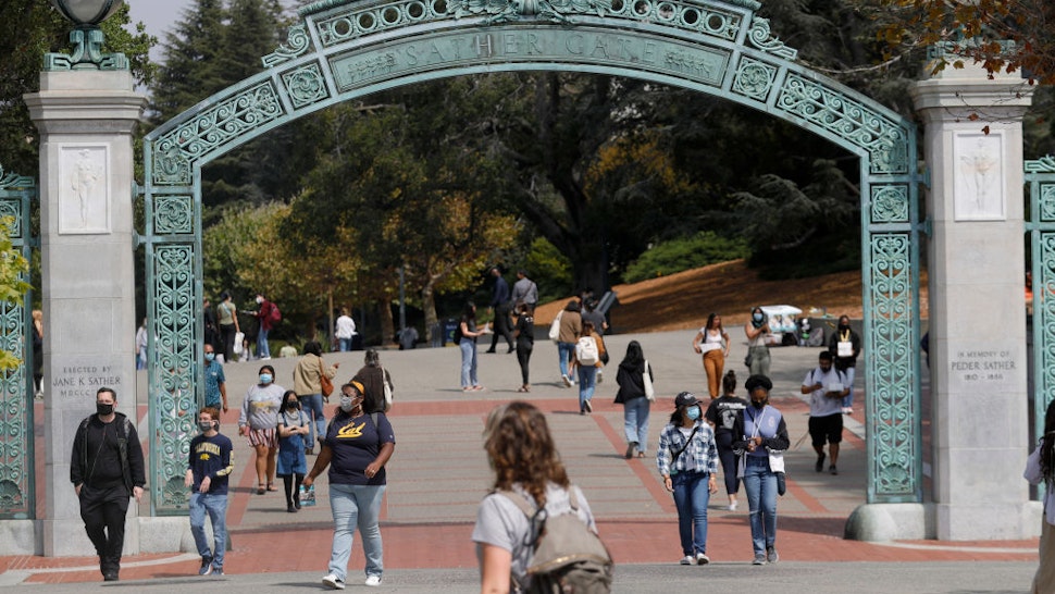 Students walk near the Sather Gate on the UC Berkeley campus in Berkeley, Calif., on Tuesday, August 24, 2021.