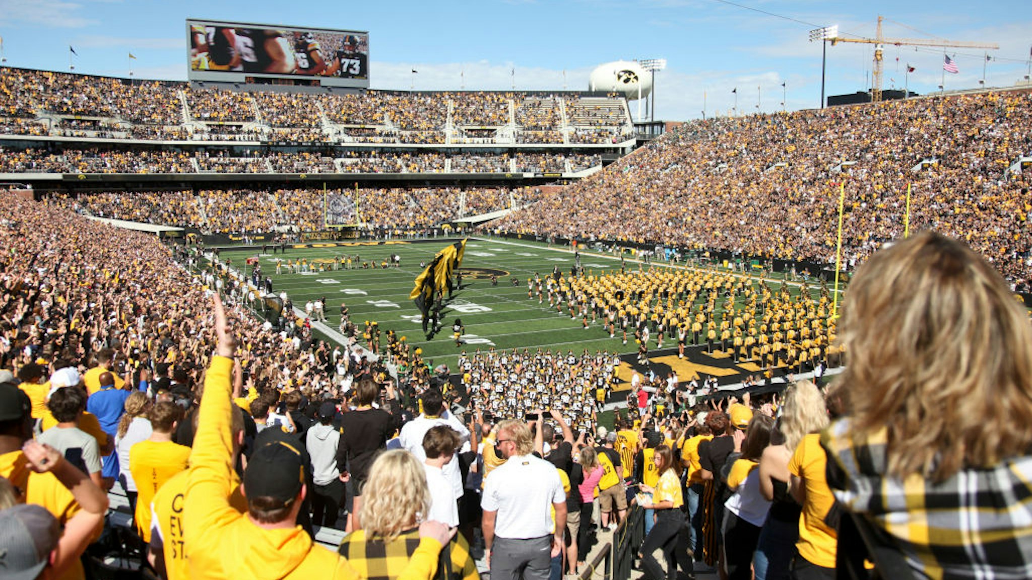 IOWA CITY, IOWA- SEPTEMBER 25: Fans cheer as players take the field before the match-up bewteen the Iowa Hawkeyes and the Colorado State Rams at Kinnick Stadium on September 25, 2021 in Iowa City, Iowa. (Photo by Matthew Holst/Getty Images)