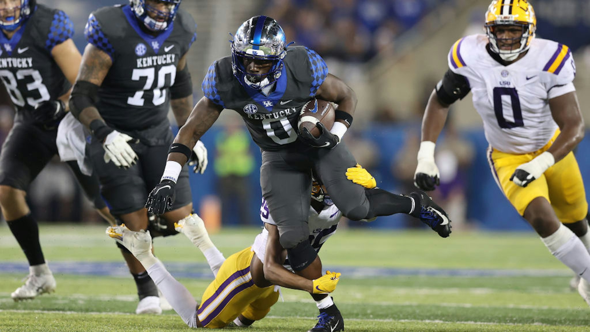 LEXINGTON, KENTUCKY - OCTOBER 09: Kavosiey Smoke #0 of the Kentucky Wildcats runs with the ball against the LSU Tigers at Kroger Field on October 09, 2021 in Lexington, Kentucky. (Photo by Andy Lyons/Getty Images)