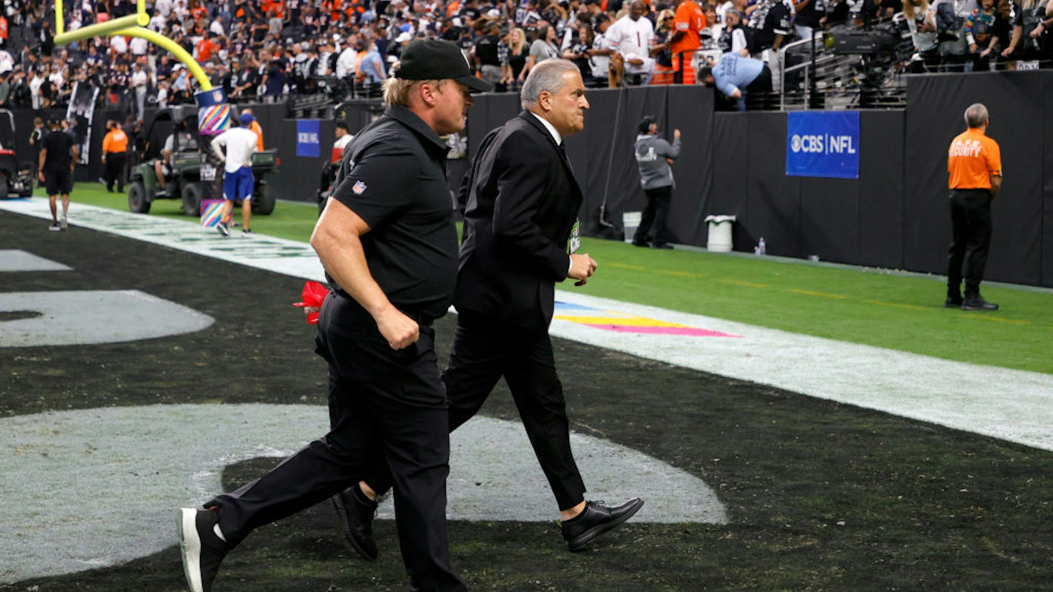 LAS VEGAS, NEVADA - OCTOBER 10: Head coach Jon Gruden (L) of the Las Vegas Raiders and Raiders director of team security Bob Stiriti run off the field after the team's 20-9 loss to the Chicago Bears at Allegiant Stadium on October 10, 2021 in Las Vegas, Nevada. (Photo by Ethan Miller/Getty Images)