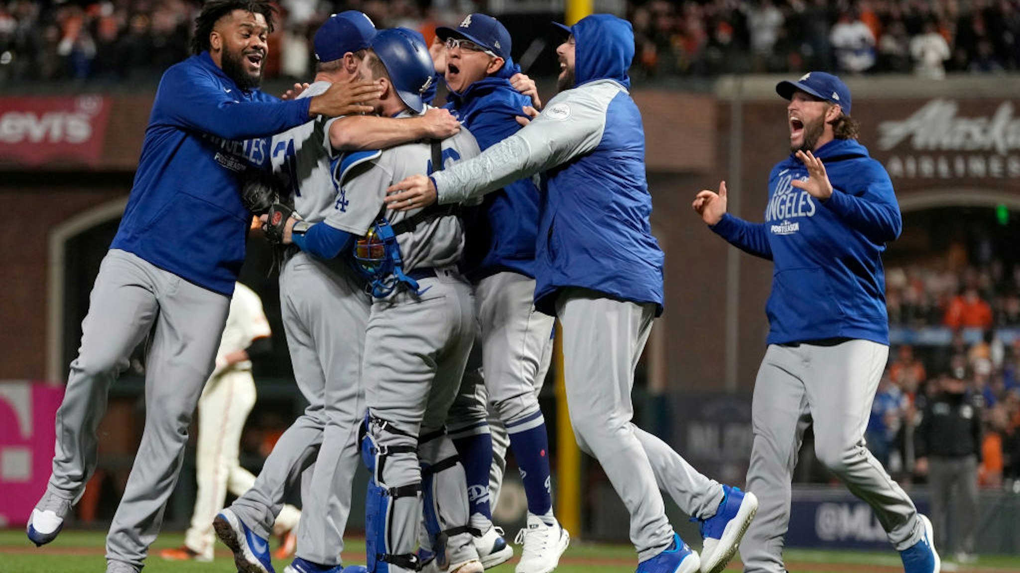 SAN FRANCISCO, CALIFORNIA - OCTOBER 14: The Los Angeles Dodgers celebrate after beating the San Francisco Giants 2-1 in game 5 of the National League Division Series at Oracle Park on October 14, 2021 in San Francisco, California. (Photo by Thearon W. Henderson/Getty Images)