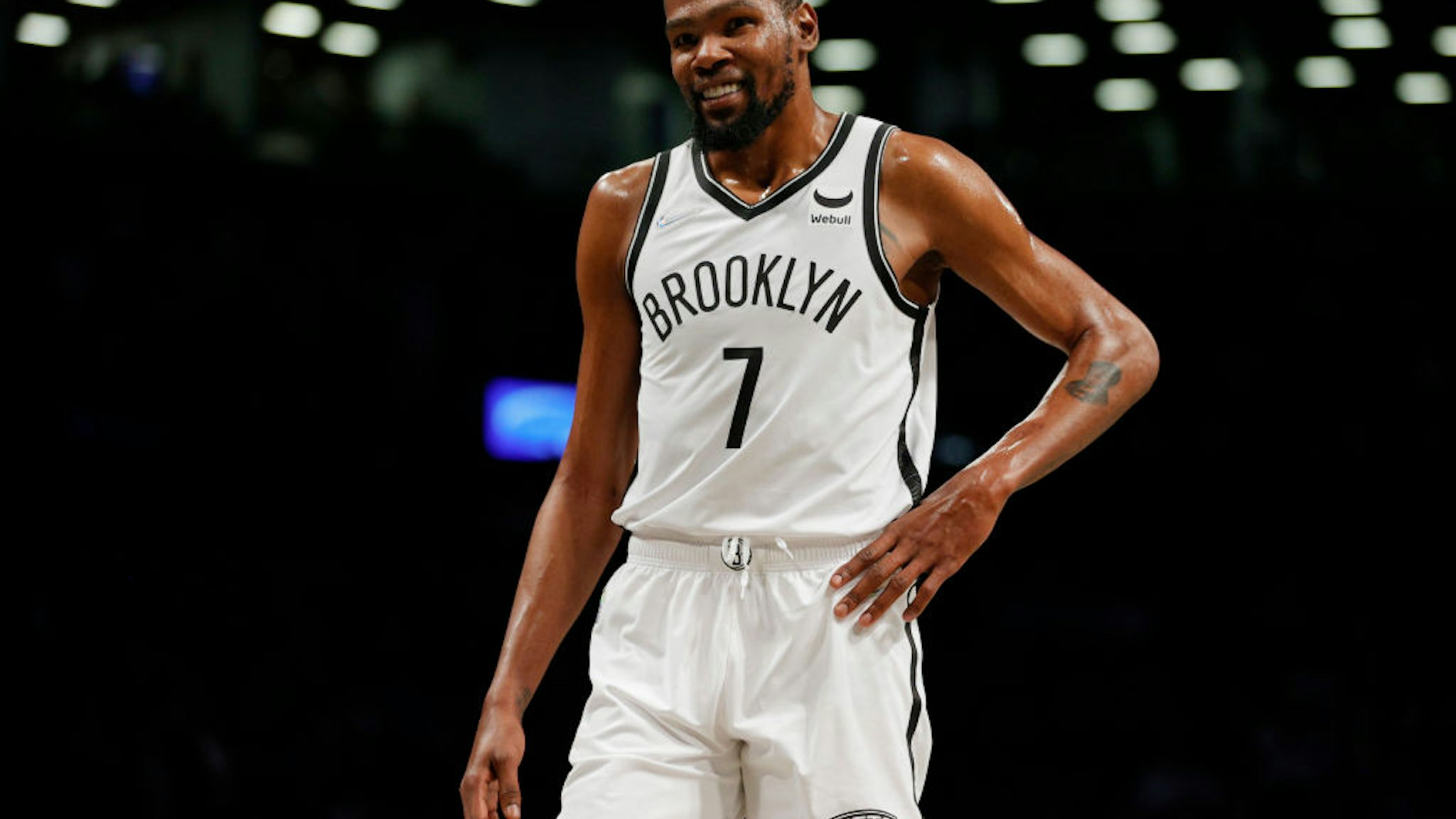 NEW YORK, NEW YORK - OCTOBER 14: Kevin Durant #7 of the Brooklyn Nets smiles during the first half against the Minnesota Timberwolves at Barclays Center on October 14, 2021 in the Brooklyn borough of New York City. NOTE TO USER: User expressly acknowledges and agrees that, by downloading and or using this photograph, user is consenting to the terms and conditions of the Getty Images License Agreement. (Photo by Sarah Stier/Getty Images)