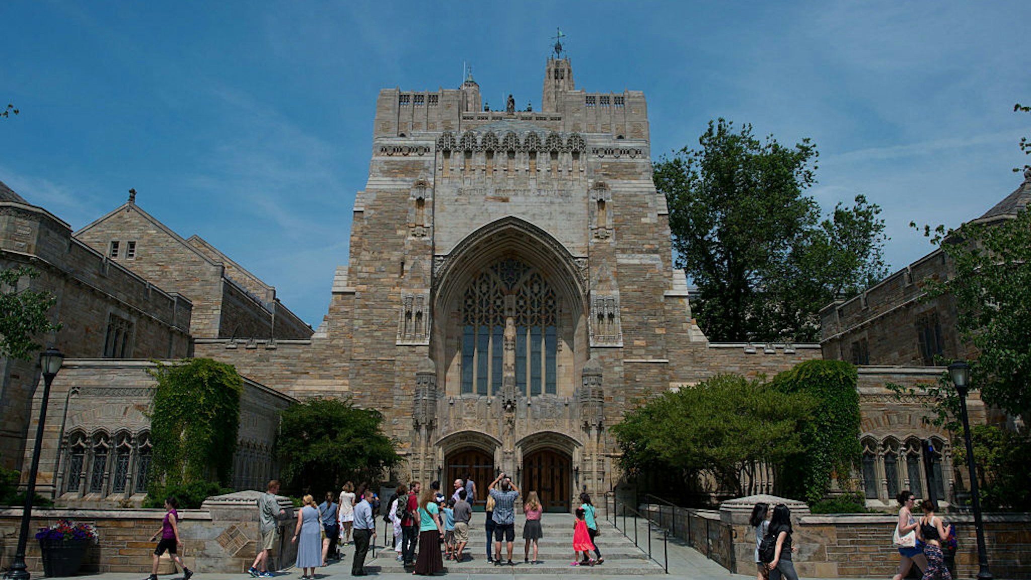 A tour group makes a stop at the Sterling Memorial Library on the Yale University campus in New Haven, Connecticut, U.S., on Friday, June 12, 2015.