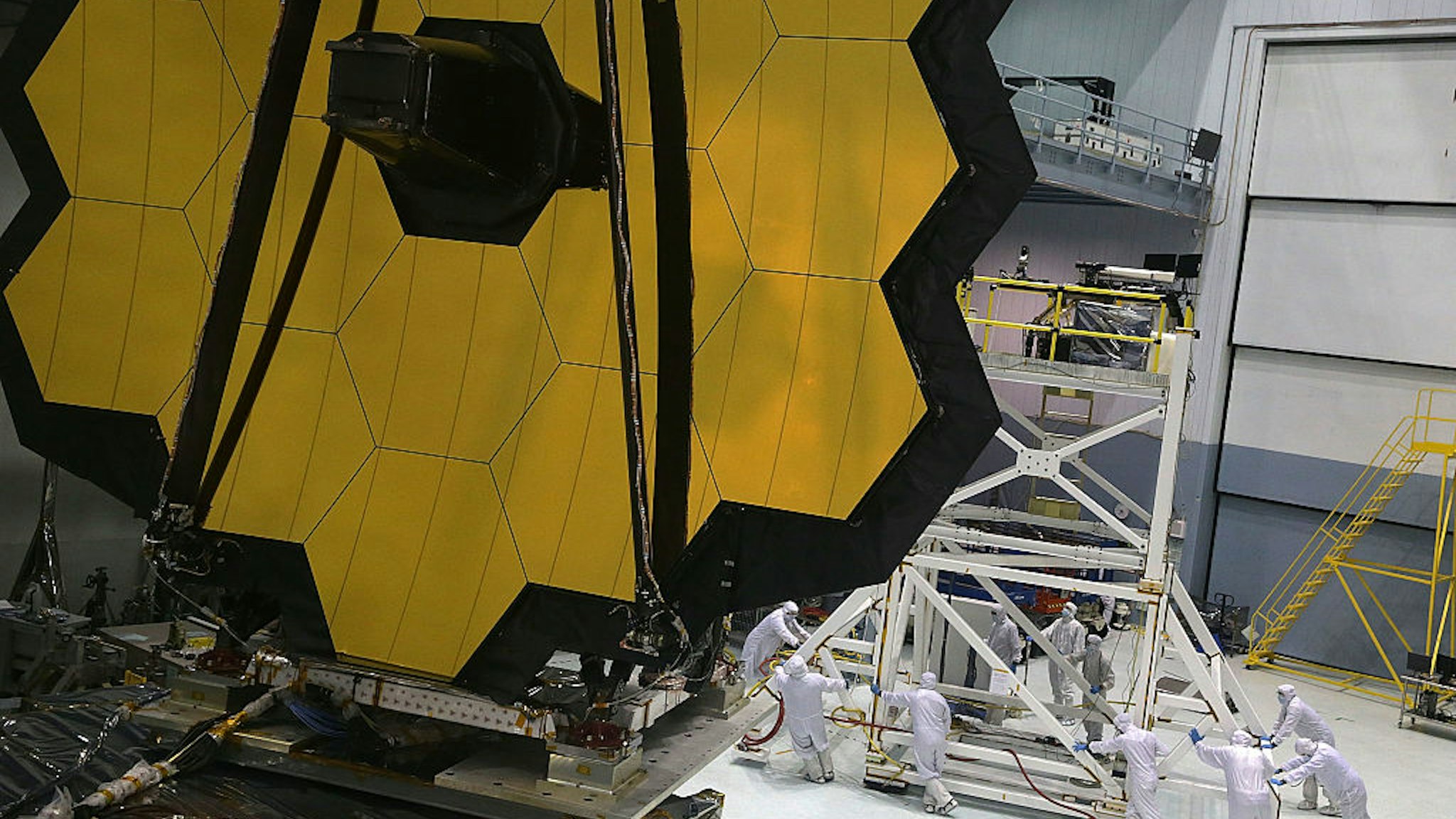 GREENBELT, MD - NOVEMBER 02: Engineers and technicians assemble the James Webb Space Telescope November 2, 2016 at NASA's Goddard Space Flight Center in Greenbelt, Maryland. The telescope, designed to be a large space-based observatory optimized for infrared wavelengths, will be the successor to the Hubble Space Telescope and the Spitzer Space Telescope. It is scheduled to be launched in October 2018. (Photo by Alex Wong/Getty Images)