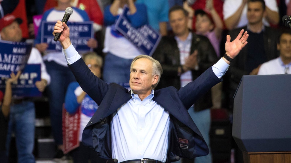 HOUSTON, TX - OCTOBER 22: Governor Greg Abbott of Texas addresses the crowd before President Donald Trump took the stage for a rally in support of Sen. Ted Cruz (R-TX) on October 22, 2018 at the Toyota Center in Houston, Texas. Cruz, the incumbent, is seeking Senate re-election in a high-profile race against Democratic challenger Beto O'Rourke.