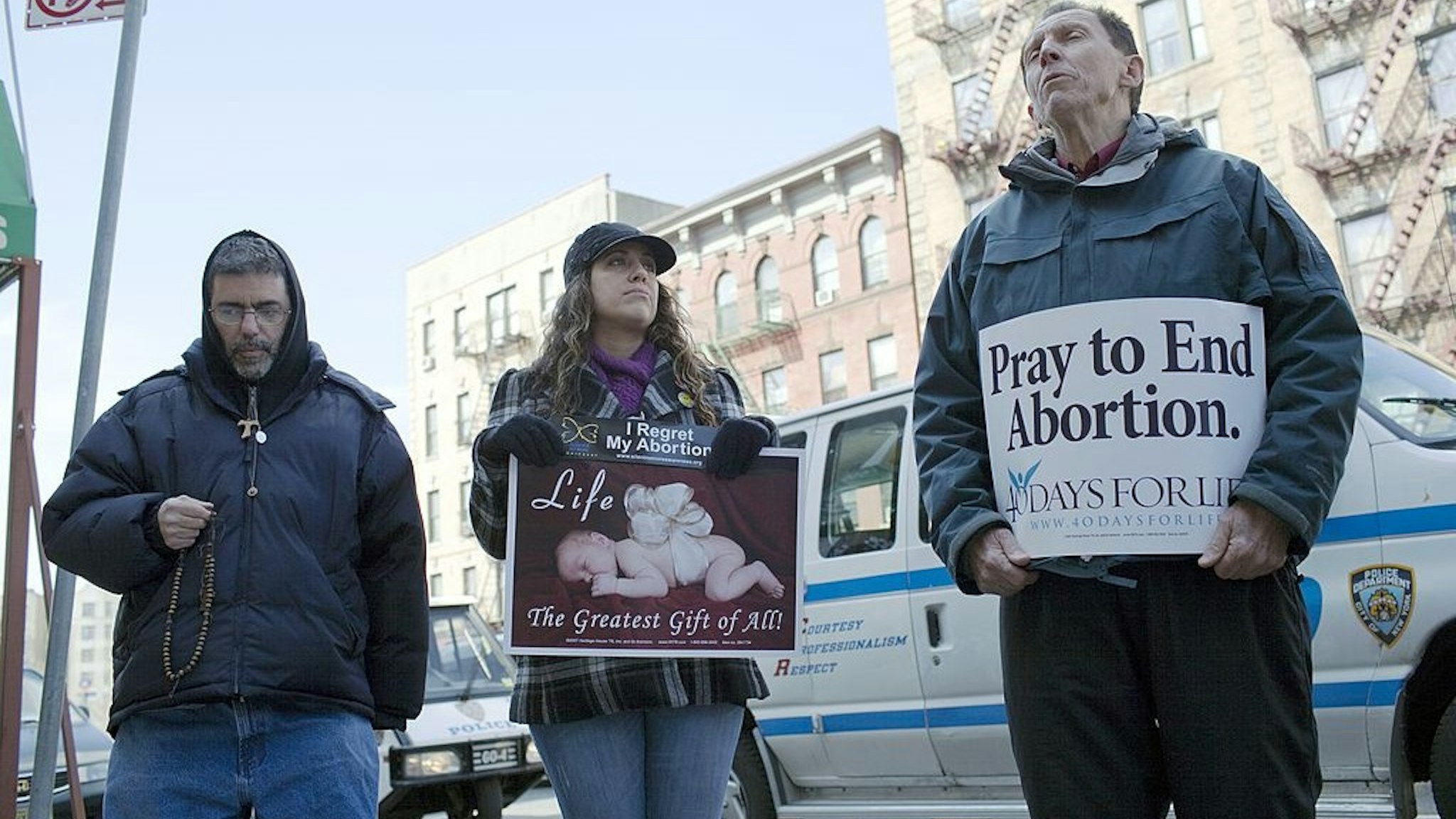 NEW YORK, NY - MARCH 12: Anti-abortion protesters line the sidewalk outside the Dr. Emily Women's Health Center March 12, 2011, in Bronx, New York.