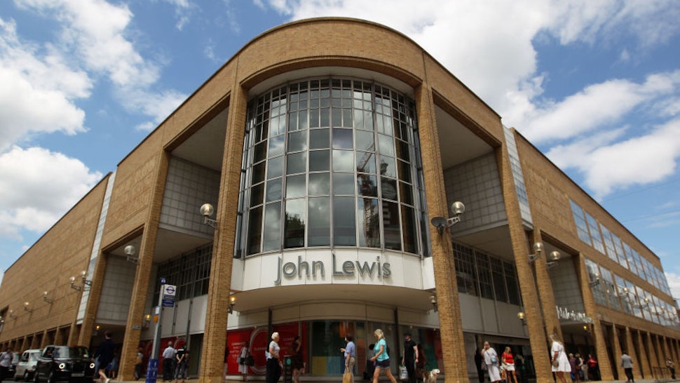 KINGSTON UPON THAMES, ENGLAND - JUNE 15: Customers queue to shop in John Lewis as it reopens its doors following a relaxtion in coronavirus lockdown measures, on June 15, 2020 in Kingston upon Thames, United Kingdom. The British government have relaxed coronavirus lockdown laws significantly from Monday June 15, allowing zoos, safari parks and non-essential shops to open to visitors. Places of worship will allow individual prayers and protective facemasks become mandatory on London Transport.