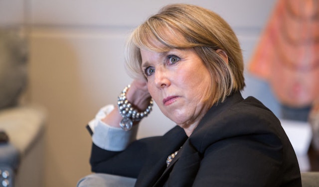 Michelle Lujan Grisham, governor of New Mexico, listens during an interview at her office in Santa Fe, New Mexico, U.S., on Thursday, Aug. 8, 2019. Lujan Grisham is balancing her concern over the catastrophic effects of climate change with the state's extraordinary dependence on oil and gas. Photographer: Steven St John/Bloomberg