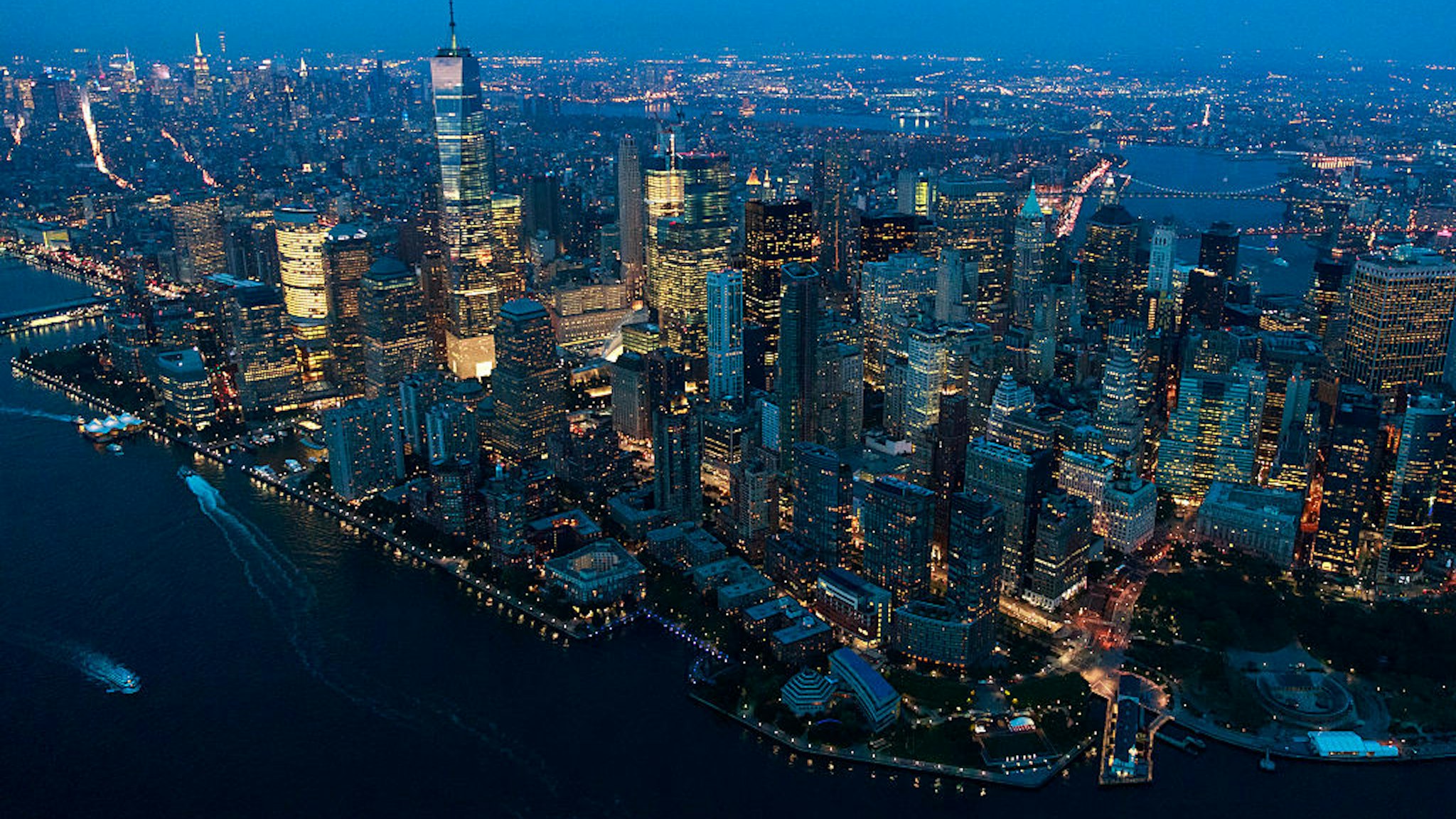 NEW YORK, NY - SEPTEMBER 8: An aerial view of Lower Manhattan at dusk, September 8, 2016 in New York City. New York City is preparing to mark the 15th anniversary of the September 11 terrorist attacks.