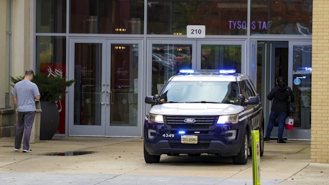 TYSON, VIRGINIA - OCTOBER 30: A police car is parked outside as people visit Tysons Corner Center Mall on October 30, 2021 in Tyson, Virginia. Law enforcement in Northern Virginia are expanding police presence at shopping malls, public centers and gatherings over the Halloween weekend in response to a potential ISIS-linked terrorist threat.