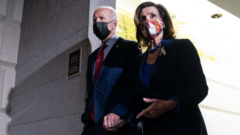 WASHINGTON, DC - OCTOBER 01: President Joe Biden and Speaker of the House Nancy Pelosi (D-CA) leave a House Democratic Caucus meeting in the U.S. Capitol on Friday, Oct. 1, 2021 in Washington, DC. The President called the meeting in order to push through an impasse with his $1 trillion infrastructure plan.