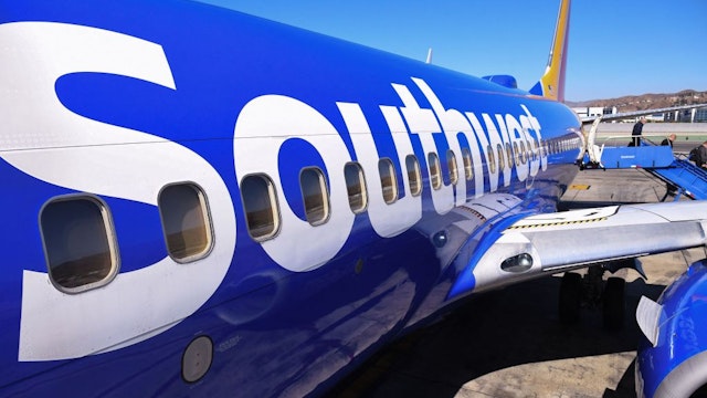 Passengers deplane from a Southwest Airlines flight from Las Vegas at Hollywood Burbank Airport in Burbank, California, October 10, 2021. - Southwest Airlines canceled hundreds of flights over the weekend, blaming the cancellations on poor weather and air traffic control issues.