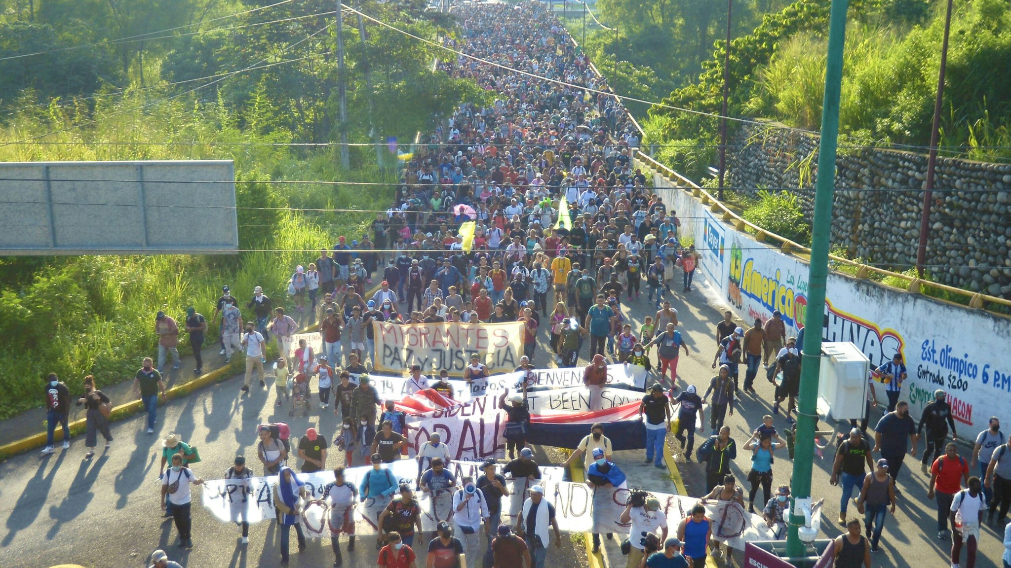 TAPACHULA, CHIAPAS, MEXICO - OCTOBER 22: Migrant caravan made up of approximately 3,000 people, called March for Freedom, Dignity and La Paz, managed to break the first police siege of the National Institute of Migration, National Guard and State Police that he was on the outskirts of Tapachula, Chiapas in Mexico on October 22, 2021. They continue on their way to Mexico City.