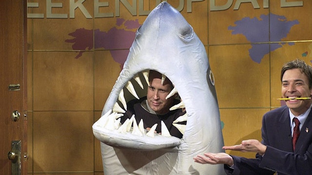 SATURDAY NIGHT LIVE -- Episode 2 -- Air Date 10/06/2001 -- Pictured: (l-r) Chevy Chase as Land Shark, Jimmy Fallon during "Weekend Update" on October 6, 2001 (Photo by