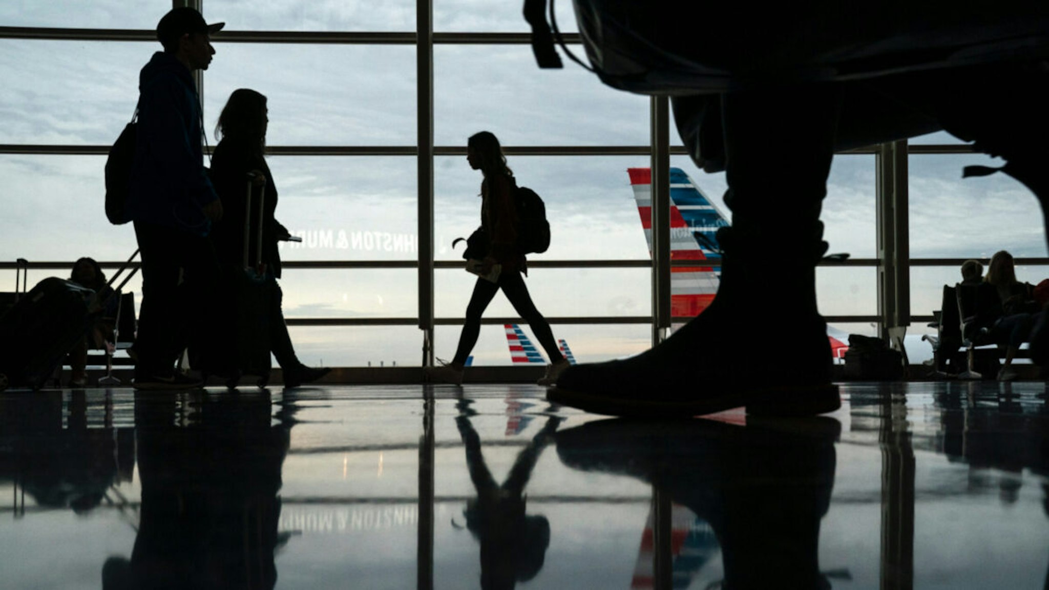 Passengers move through Ronald Reagan National Airport on the day before the Thanksgiving holiday, November 27, 2019 in Arlington, Virginia.