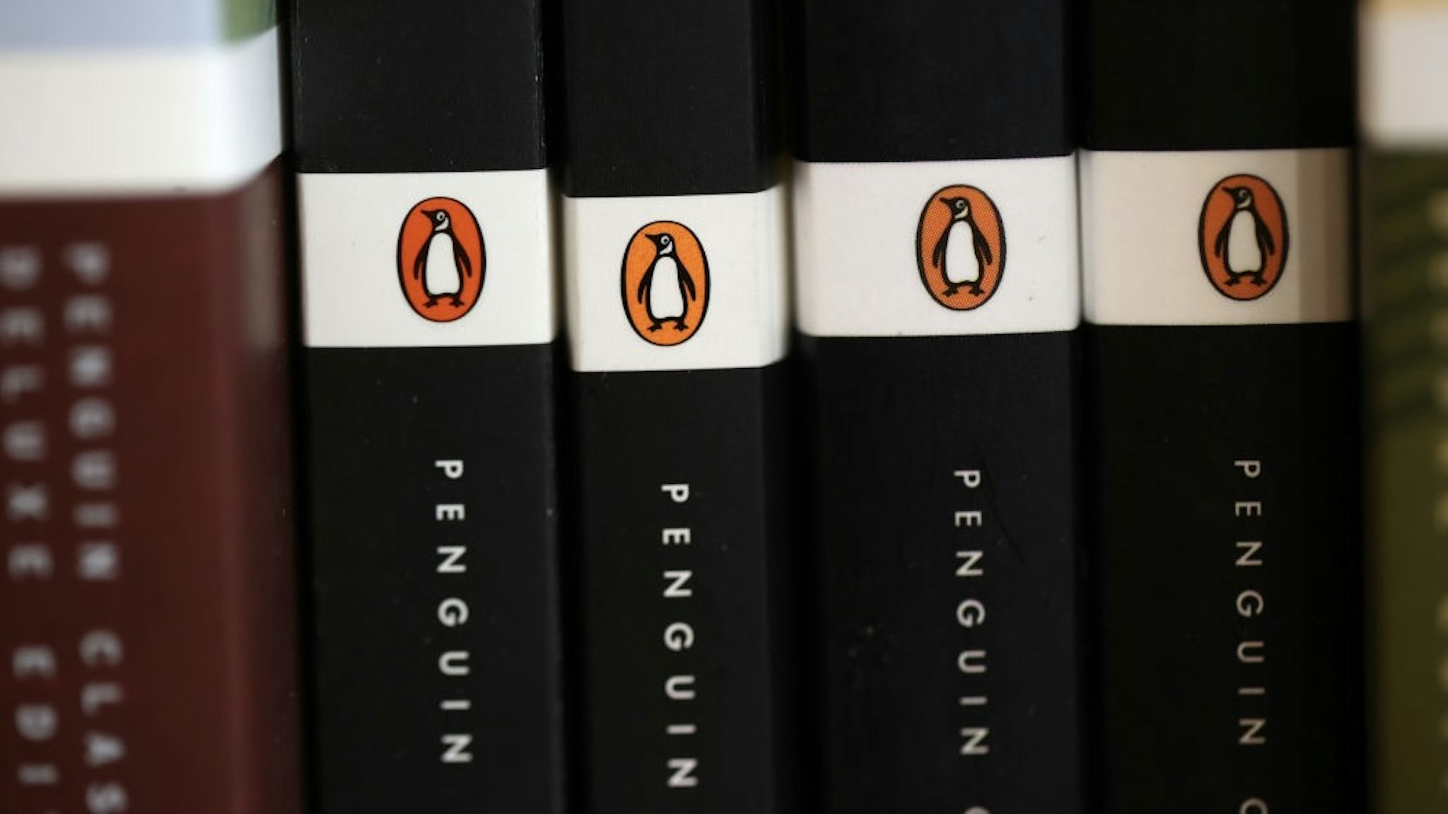 DOJ Sues To Block Penguin Random House's Acquisition Of Rival Simon And Schuster CORTE MADERA, CALIFORNIA - NOVEMBER 02: The Penguin logo is visible on the spines of books displayed on a shelf at Book Passage on November 02, 2021 in Corte Madera, California. The U.S. Department of Justice is suing Penguin Random House and Simon & Schuster to block the companies from completing a merger valued at $2.175 billion. (Photo by Justin Sullivan/Getty Images) Justin Sullivan / Staff
