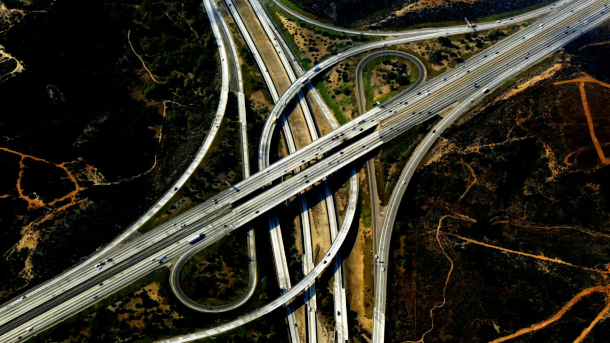 A freeway interchange with burnt fields nearby is seen in this aerial view October 30, 2003 in San Diego, California.