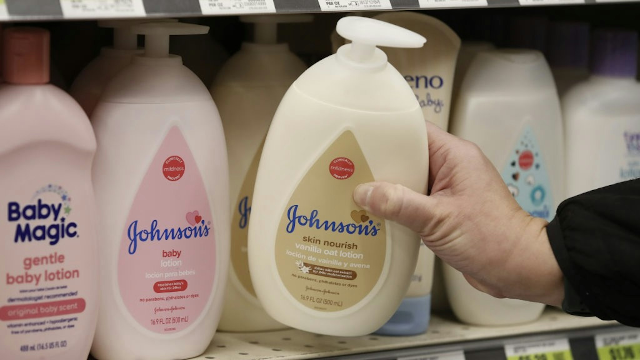 Johnson & Johnson Products As Company's Covid Vaccine Found Effective By FDA A bottle of Johnson & Johnson's brand lotion for sale at a pharmacy in Salt Lake City, Utah, U.S., on Thursday, Feb. 25, 2021. Johnson & Johnsons Covid-19 vaccine is safe and effective, U.S. regulators said, a key milestone on the path toward giving Americans access to the first such shot to work in a single dose. Photographer: George Frey/Bloomberg via Getty Images Bloomberg / Contributor