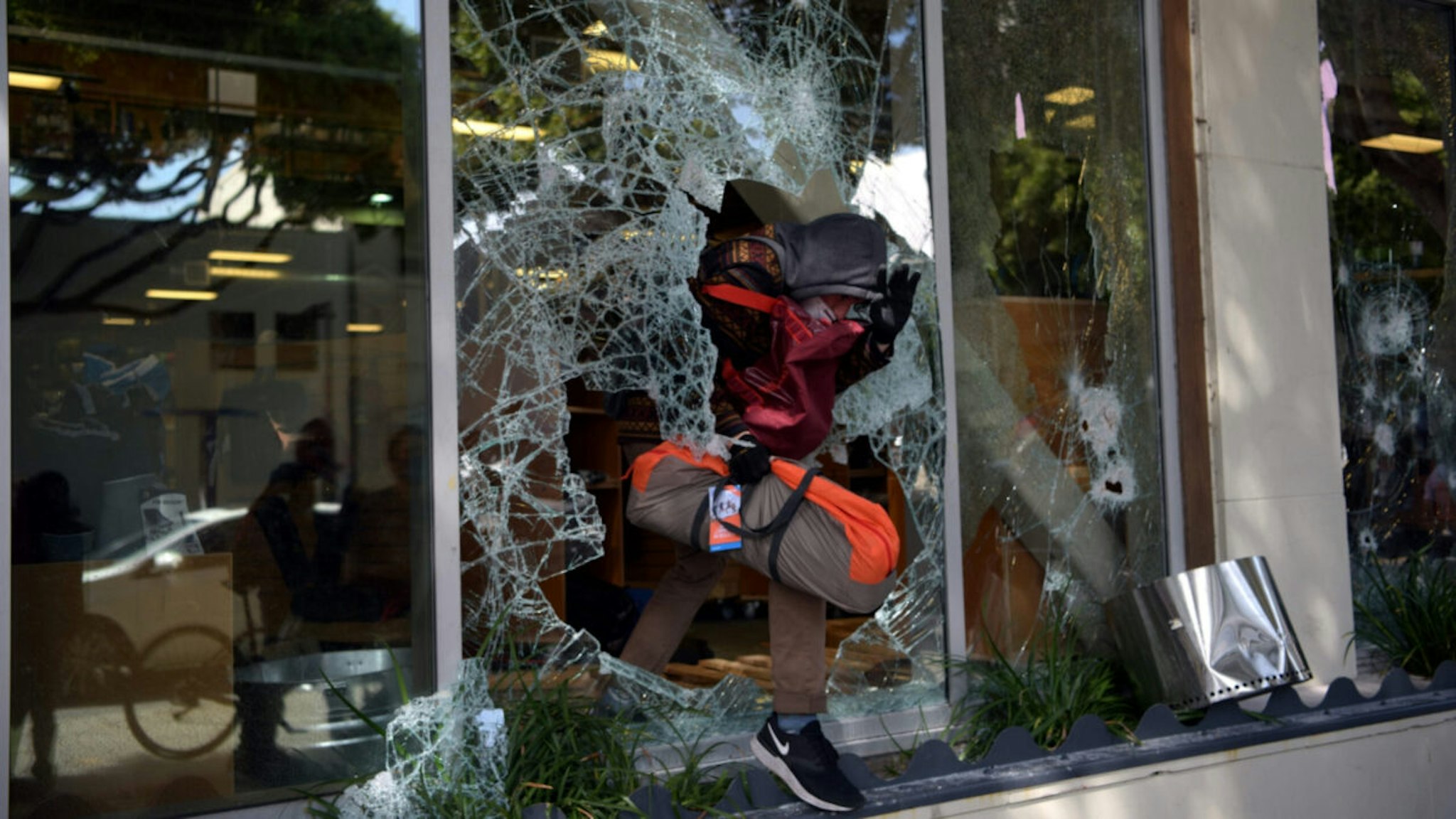 Protesters loot shops during a demonstration over the death of George Floyd at the hands of Minneapolis Police, in Santa Monica, California, on May 31, 2020.
