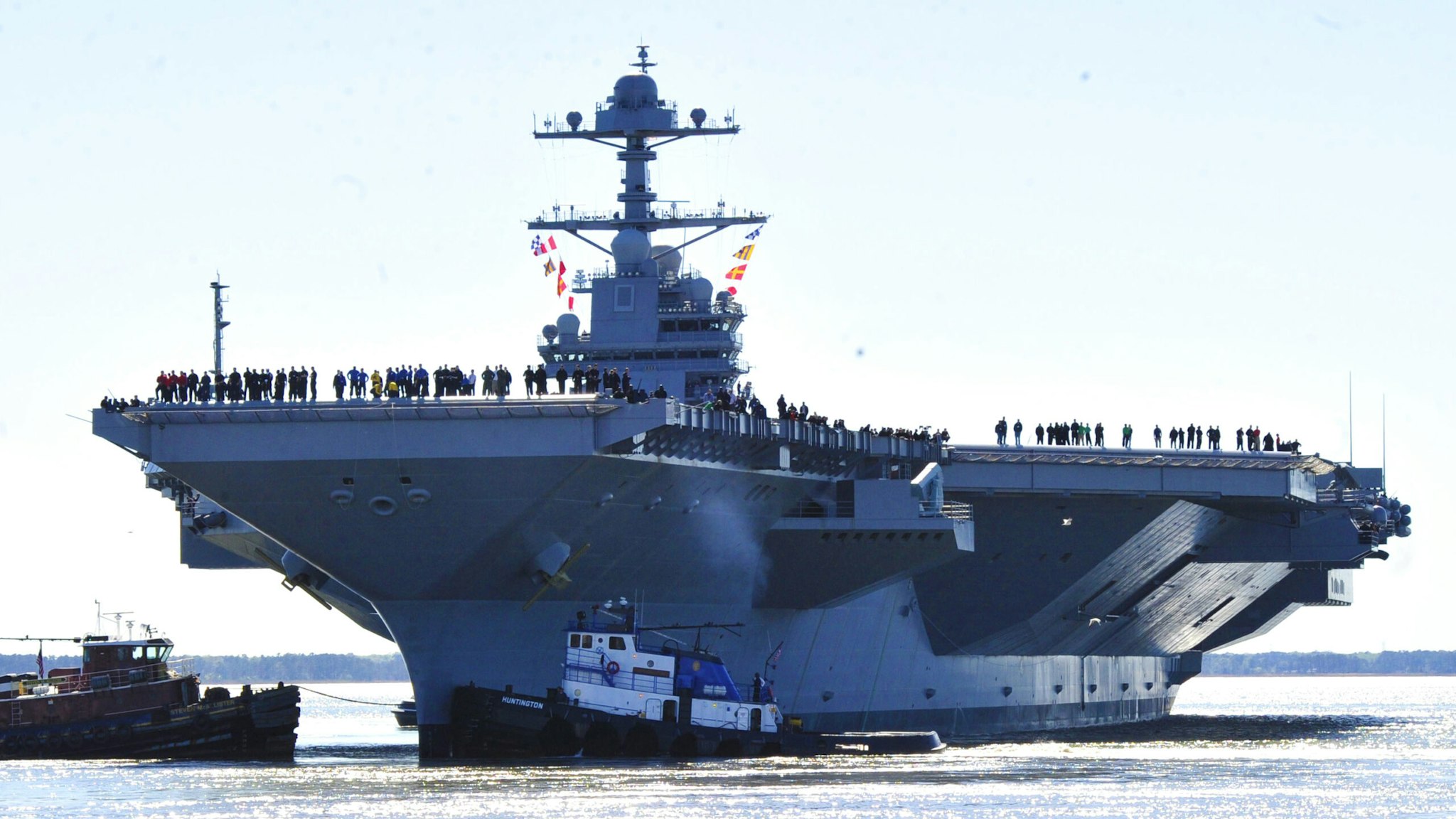 NEWPORT NEWS, VA - APRIL 8: In this handout photo provided by the U.S. Navy, the aircraft carrier Pre-Commissioning Unit (PCU) Gerald R. Ford (CVN 78) departs Huntington Ingalls Industries Newport News Shipbuilding for builder's sea trials off the U.S. East Coast on April 8, 2017 in Newport News, Virginia. The first-of-class ship, the first new U.S. aircraft carrier design in 40 years, will spend several days conducting builder's sea trials, a comprehensive test of many of the ship's key systems and technologies.