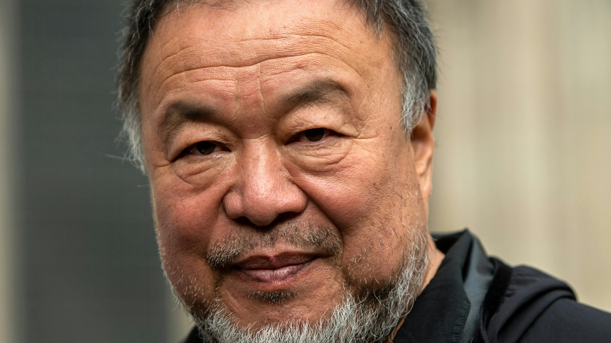 LONDON, ENGLAND - OCTOBER 27: Chinese dissident artist and activist Ai Weiwei is seen outside the Royal Courts of Justice during an appeal hearing for Julian Assanges extradition to the United States on October 27, 2021 in London, England. The United States, which has charged the Wikileaks founder with espionage, had appealed a January ruling that Assange should not be extradited to the US due to concerns over his mental health and the risk of suicide in a US prison.