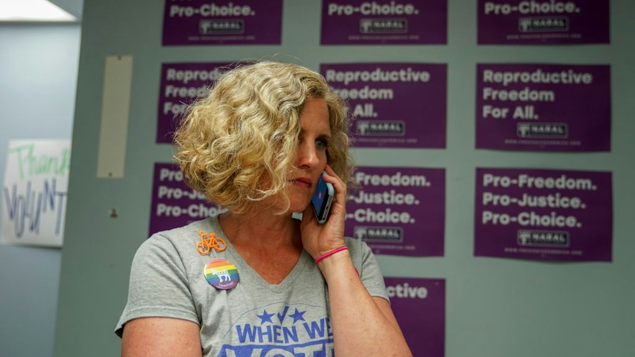 STERLING, VA - JULY 17: Juli Briskman, the Democratic nominee for Supervisor of Loudoun County's Algonkian District, takes a phone call in her campaign office as she prepares to door-to-door canvas in her neighborhood on Wednesday, July 17, 2019, in Sterling, VA. Briskman is the cyclist who was photographed flipping off Trump's presidential motorcade, only to be fired from her job. That got her angry, so she's running for Supervisor in her Virginia district.