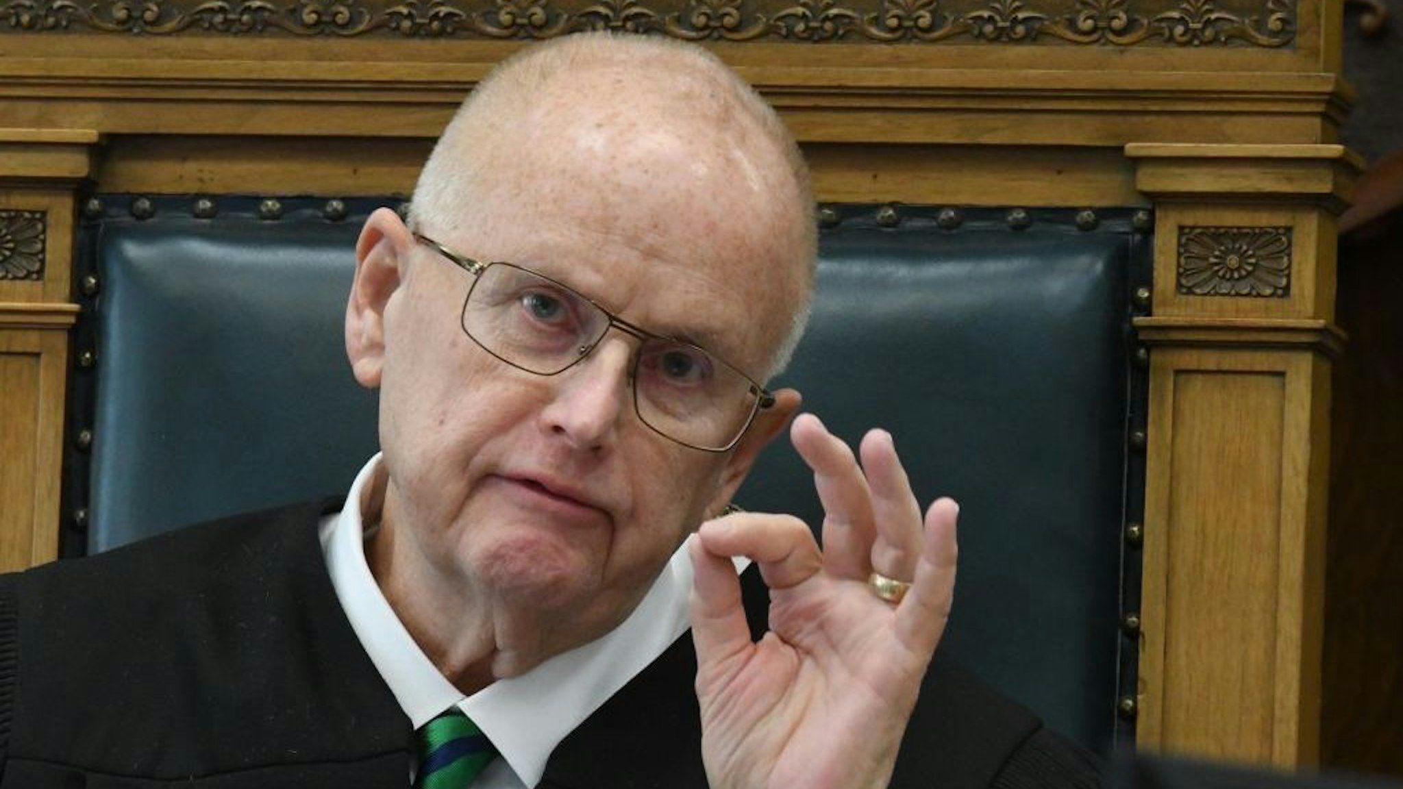 KENOSHA, WISCONSIN - NOVEMBER 05: Circuit Court Judge BRUCE E. SCHROEDER consults law books as an evidentiary question is considered outside of the presence of the jury at the start of the afternoon session in the trial of Kyle Rittenhouse on November 5, 2021 in Kenosha, Wisconsin. Rittenhouse is accused of shooting three demonstrators, killing two of them, during a night of unrest that erupted in Kenosha after a police officer shot Jacob Blake seven times in the back while being arrested in August 2020. Rittenhouse, from Antioch, Illinois, was 17 at the time of the shooting and armed with an assault rifle. He faces counts of felony homicide and felony attempted homicide. (Photo by Mark Hertzberg-Pool/Getty Images)