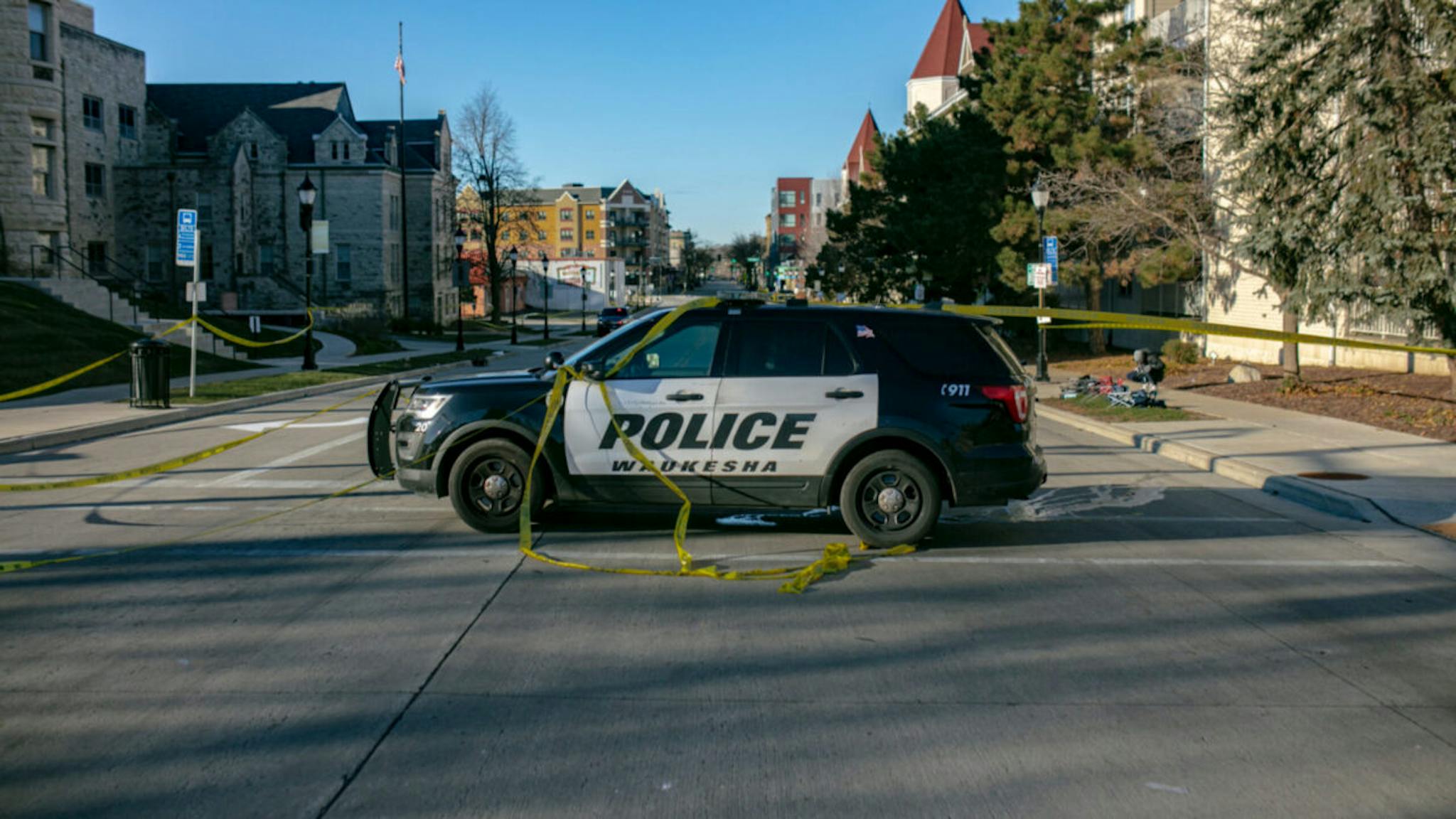 Police Police block off road entrances following a driver plowing into the Christmas parade on Main Street in downtown November 22, 2021 in Waukesha, Wisconsin.