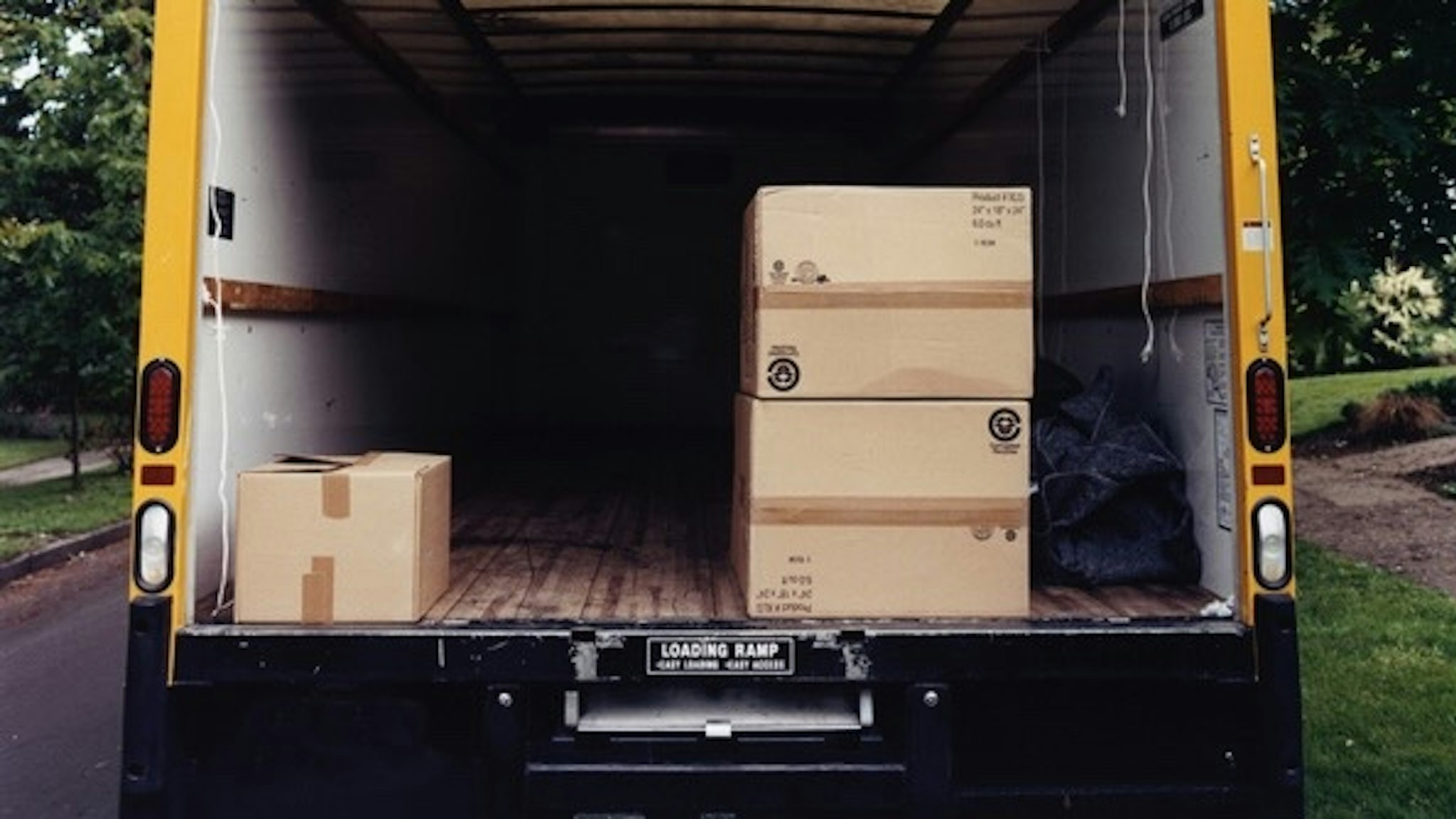 Boxes in Back of Moving Van - stock photo Charles Gullung via Getty Images